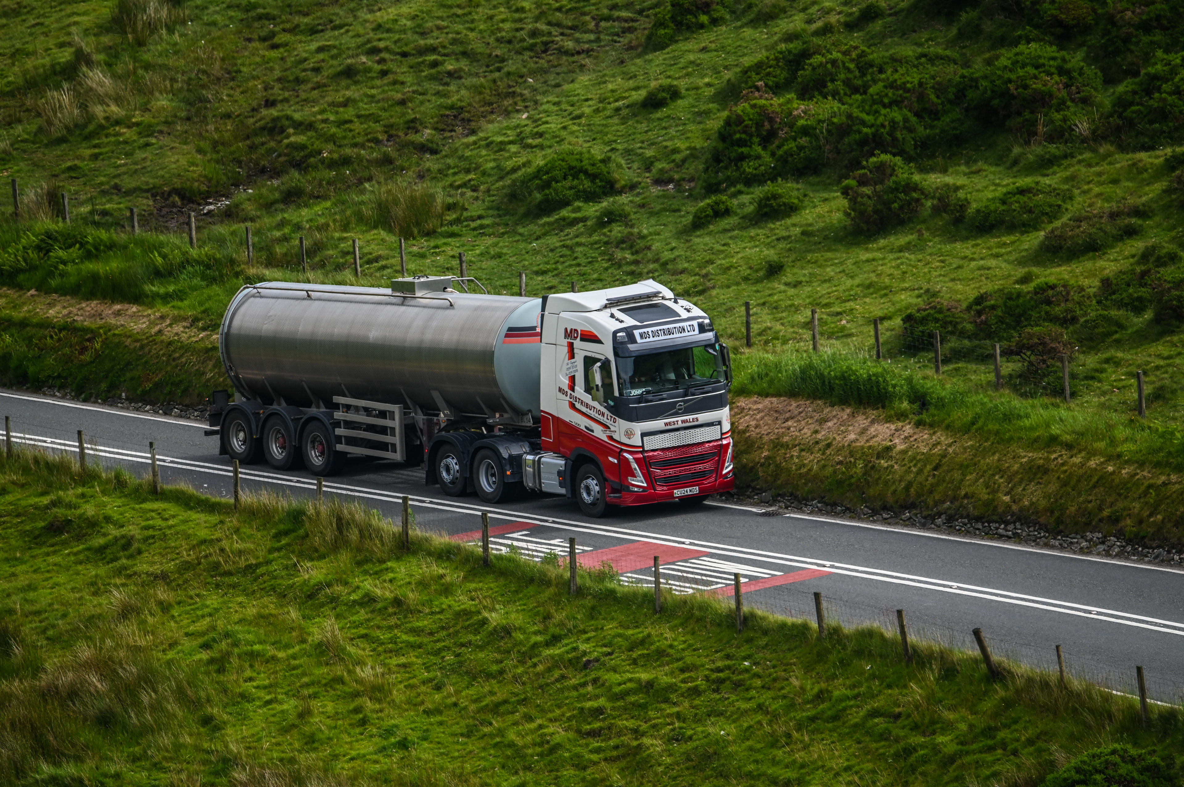 MDS distributions Volvo FH pulling a road tanker in Mid Wales