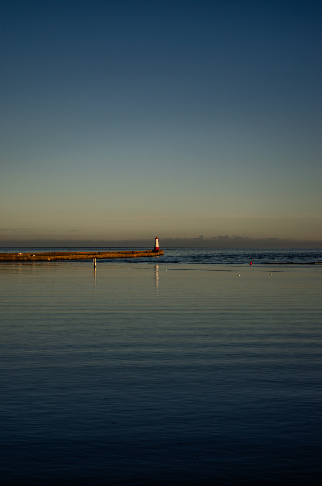 The Berwick Lighthouse stands out from the sea