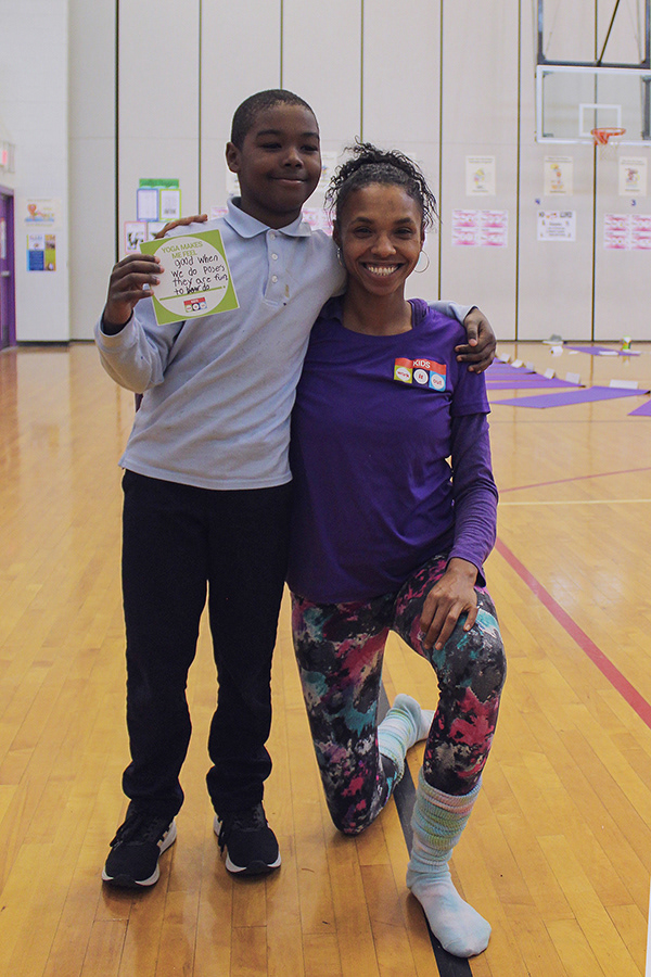 Adrienne, our Yoga Instructor, posing with a student.