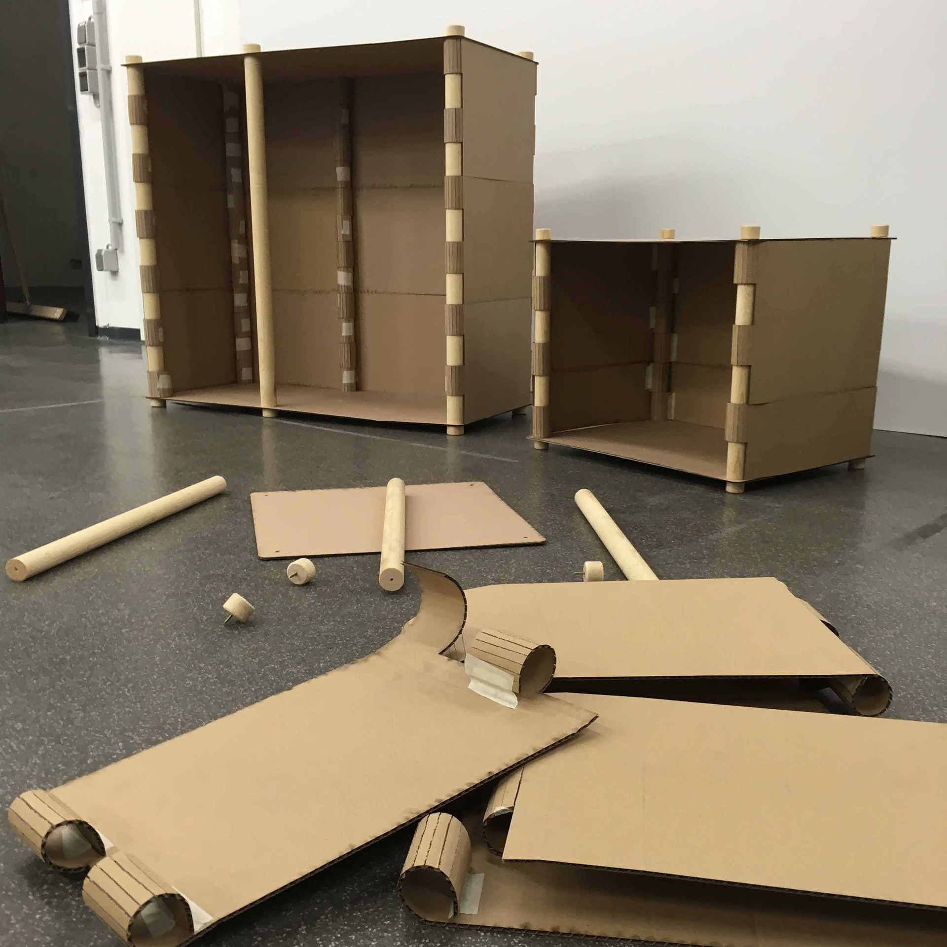 Cardboard model of the sheet metal on wooden rods design.
