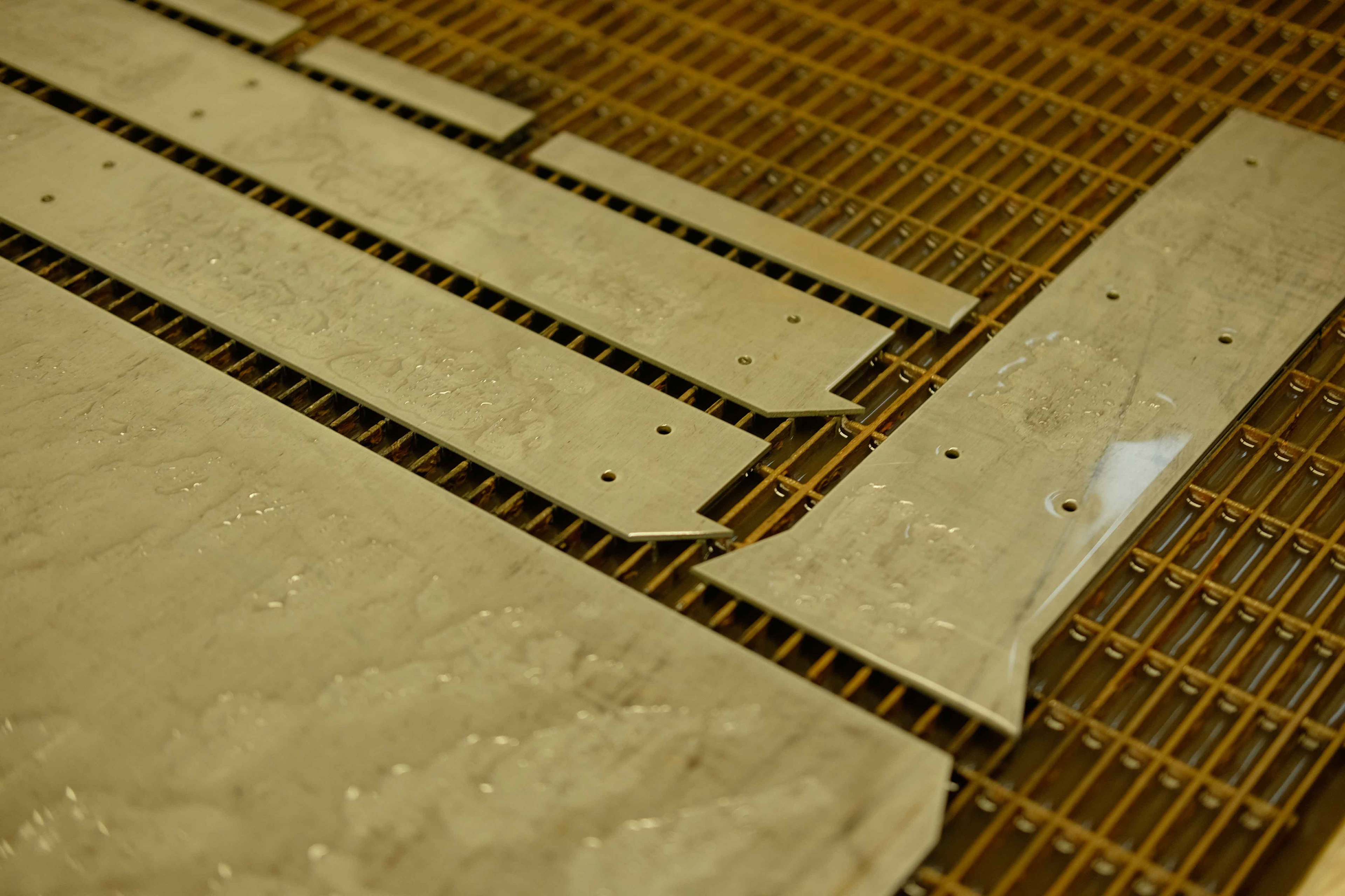 Waterjet cutting the bridges.