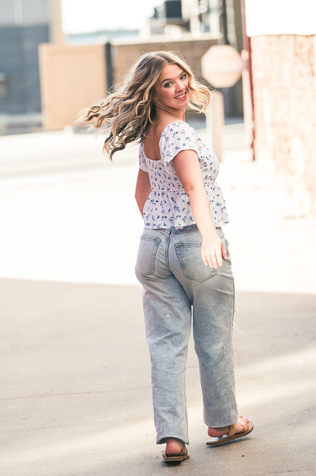 Urban style seniorCustom senior photo session featuring a motorcycle for a unique, editorial look. Personalized graduation portraits in St. Joseph Missouri that capture individual personality and style. portrait session for high school graduates in Kansas City. Creative outdoor photography using natural light and professional posing in downtown environments.