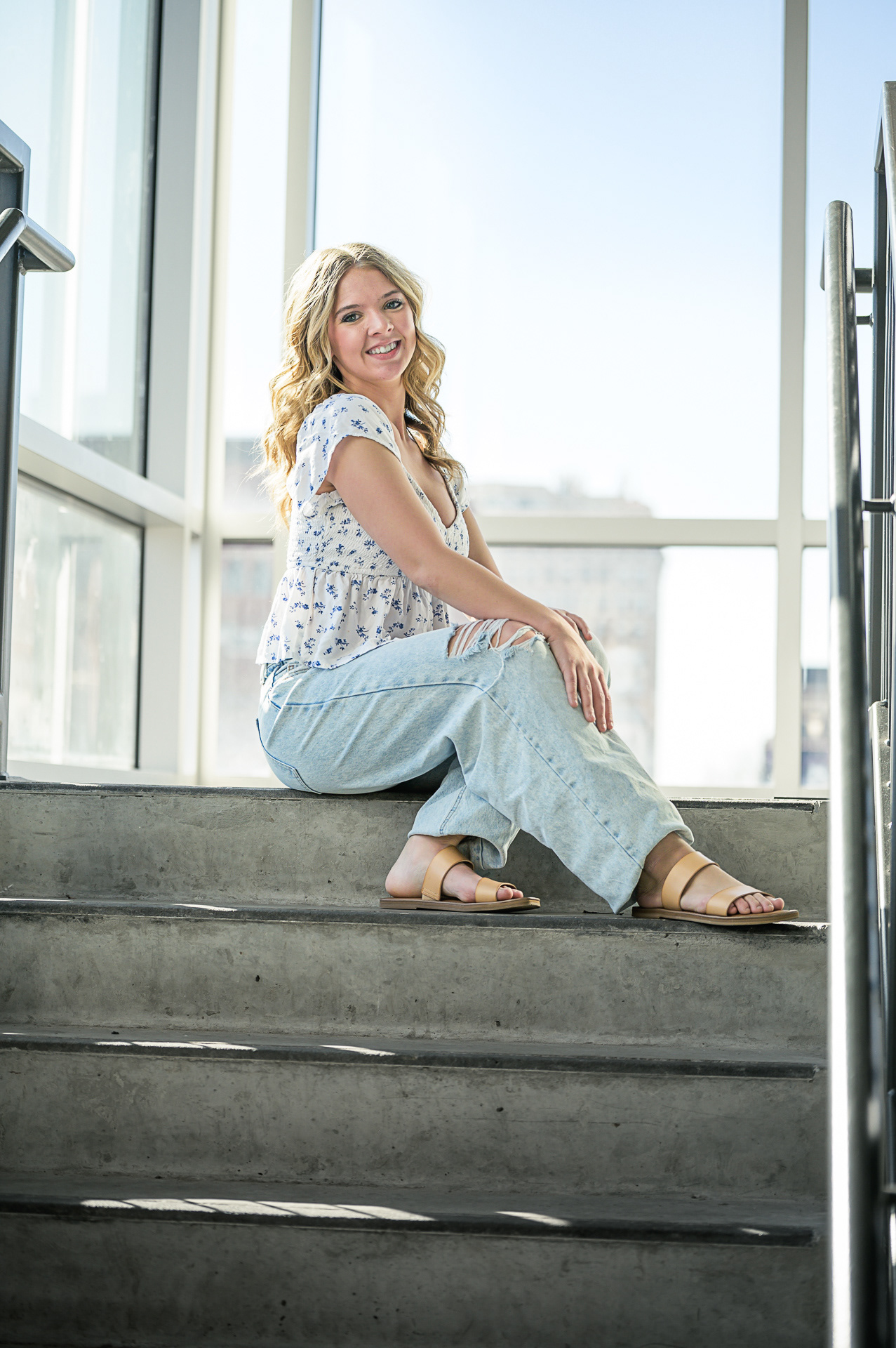 High school graduation portrait photographer serving St. Joseph and Kansas City. Professional 85mm lens technique for high-end bokeh and authentic expressions in every portrait.