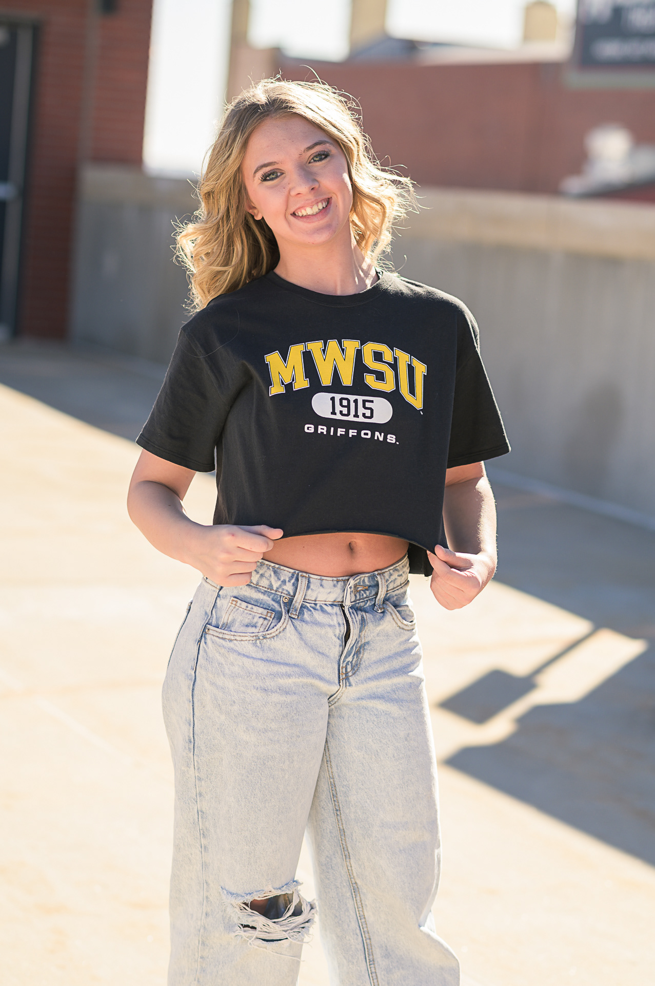 Urban style senior portrait session for high school graduates in Kansas City. Creative outdoor photography using natural light and professional posing in downtown environments.