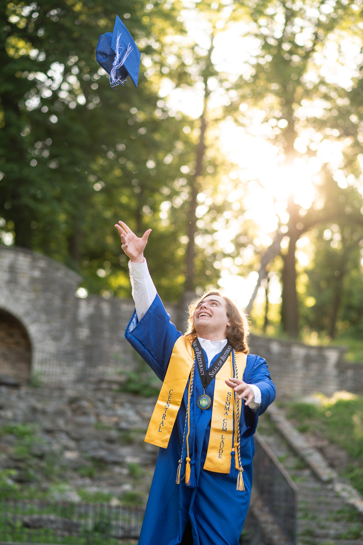 High school graduation portrait photographer serving St. Joseph and Kansas City. Professional 85mm lens technique for high-end bokeh and authentic expressions in every portrait.