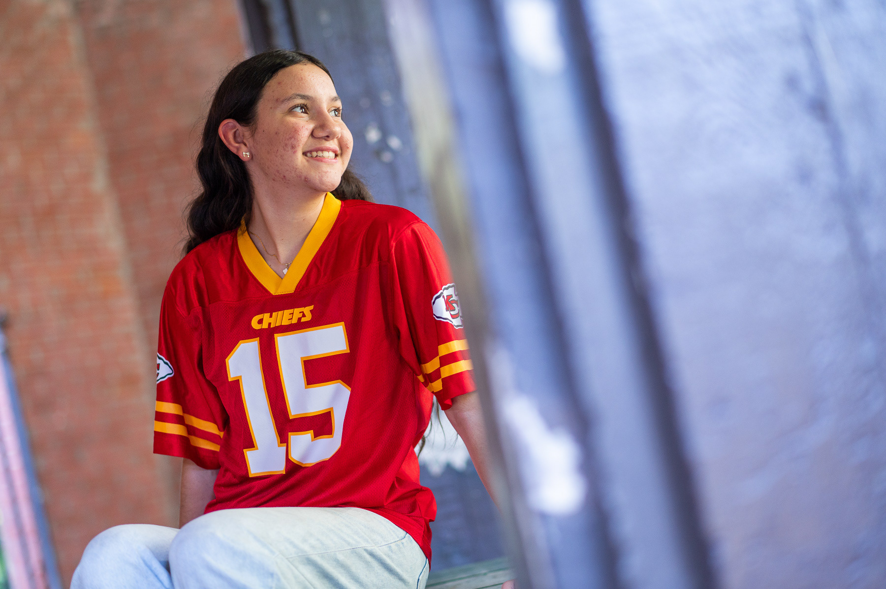 High school graduation portrait photographer serving St. Joseph and Kansas City. Professional 85mm lens technique for high-end bokeh and authentic expressions in every portrait.