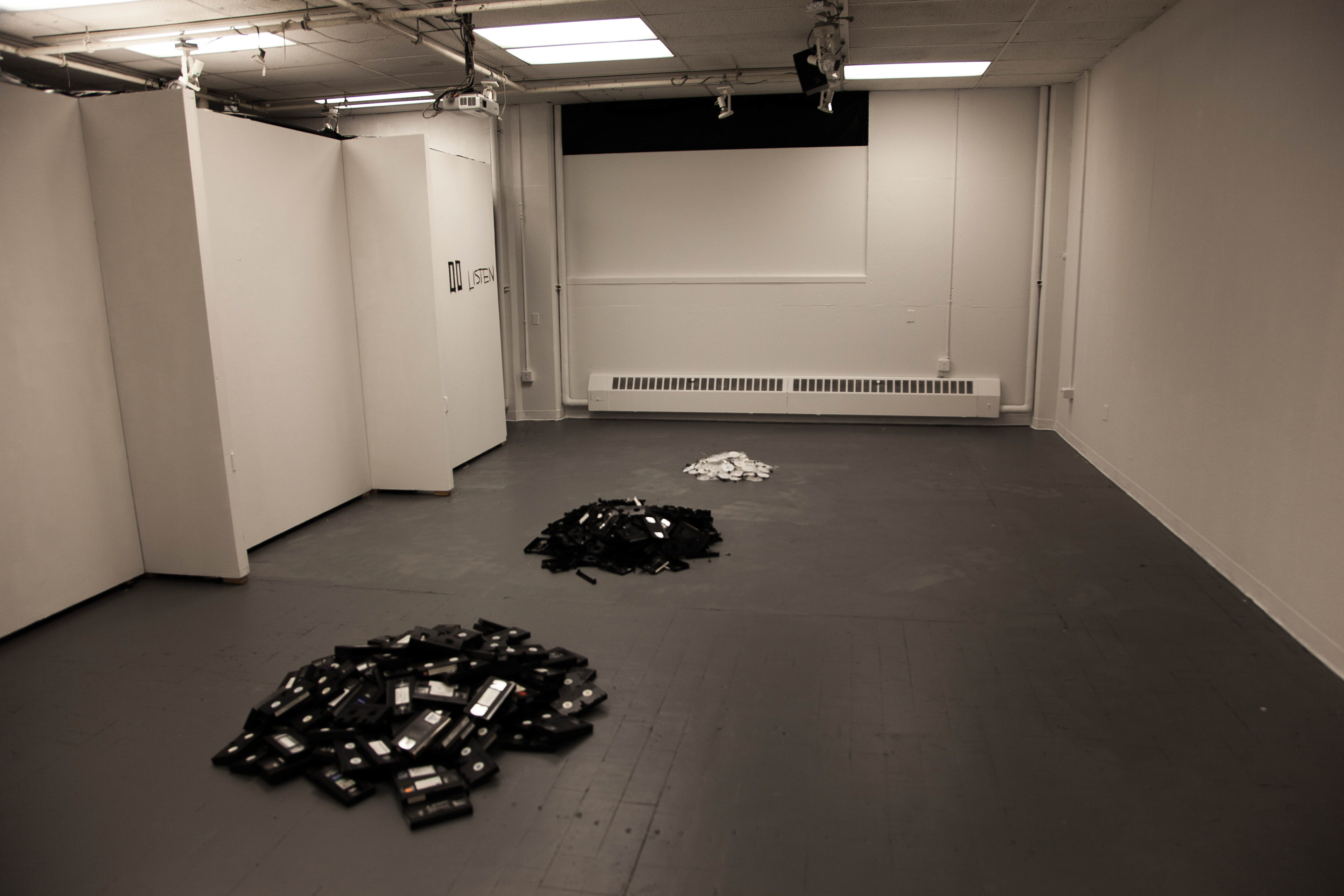 Looking from entry: first room arrangement had piles of refuse materials that from what we used