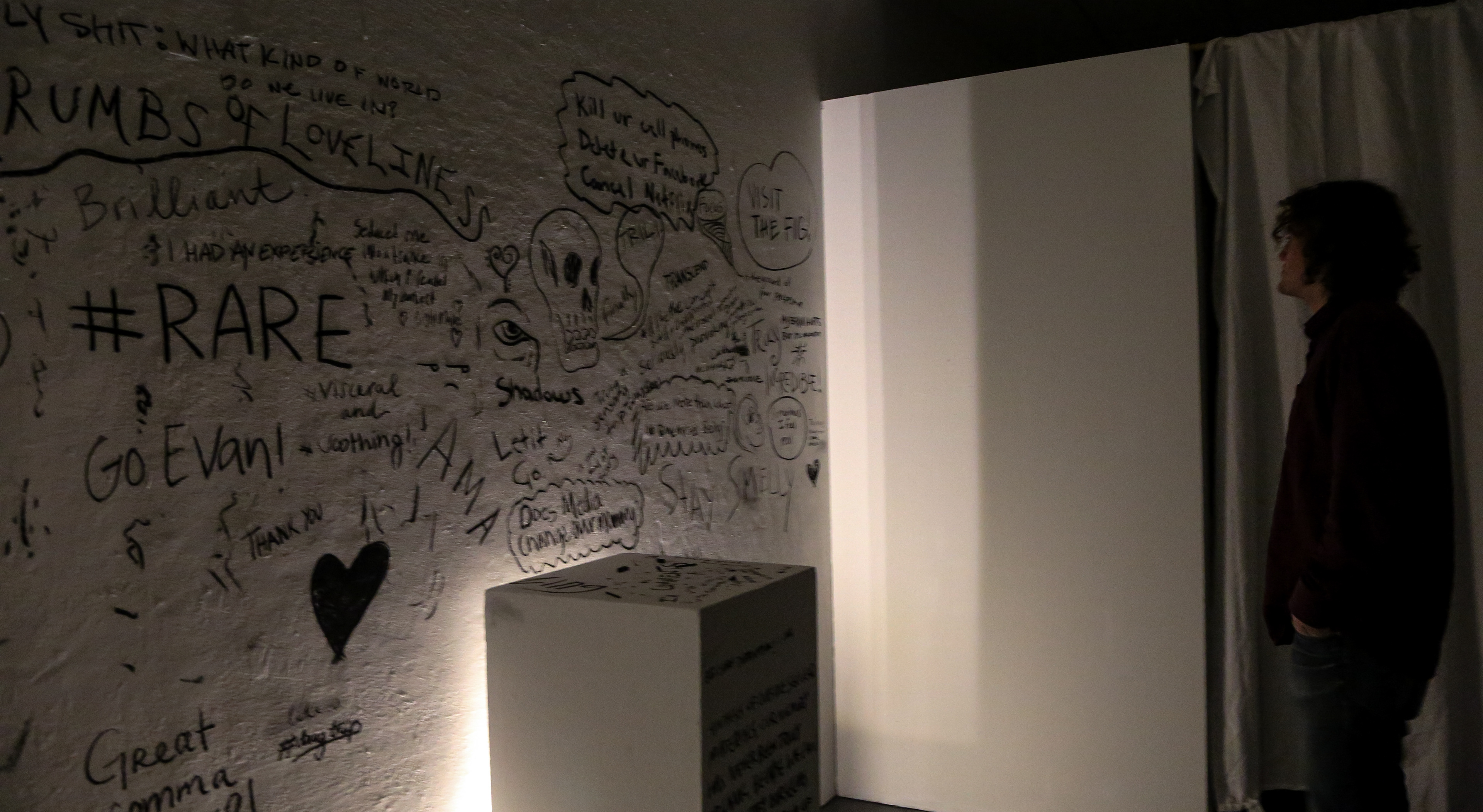 Exhibit comments were written with charcoal on a wall as well