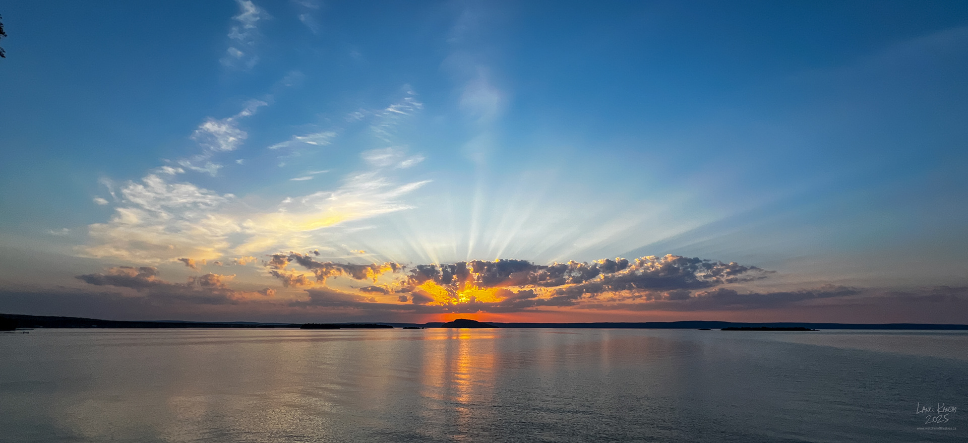 Sunrise crepuscular rays over Caribou Island, Amethyst Bay, Lake Superior - Oct 2, 2025