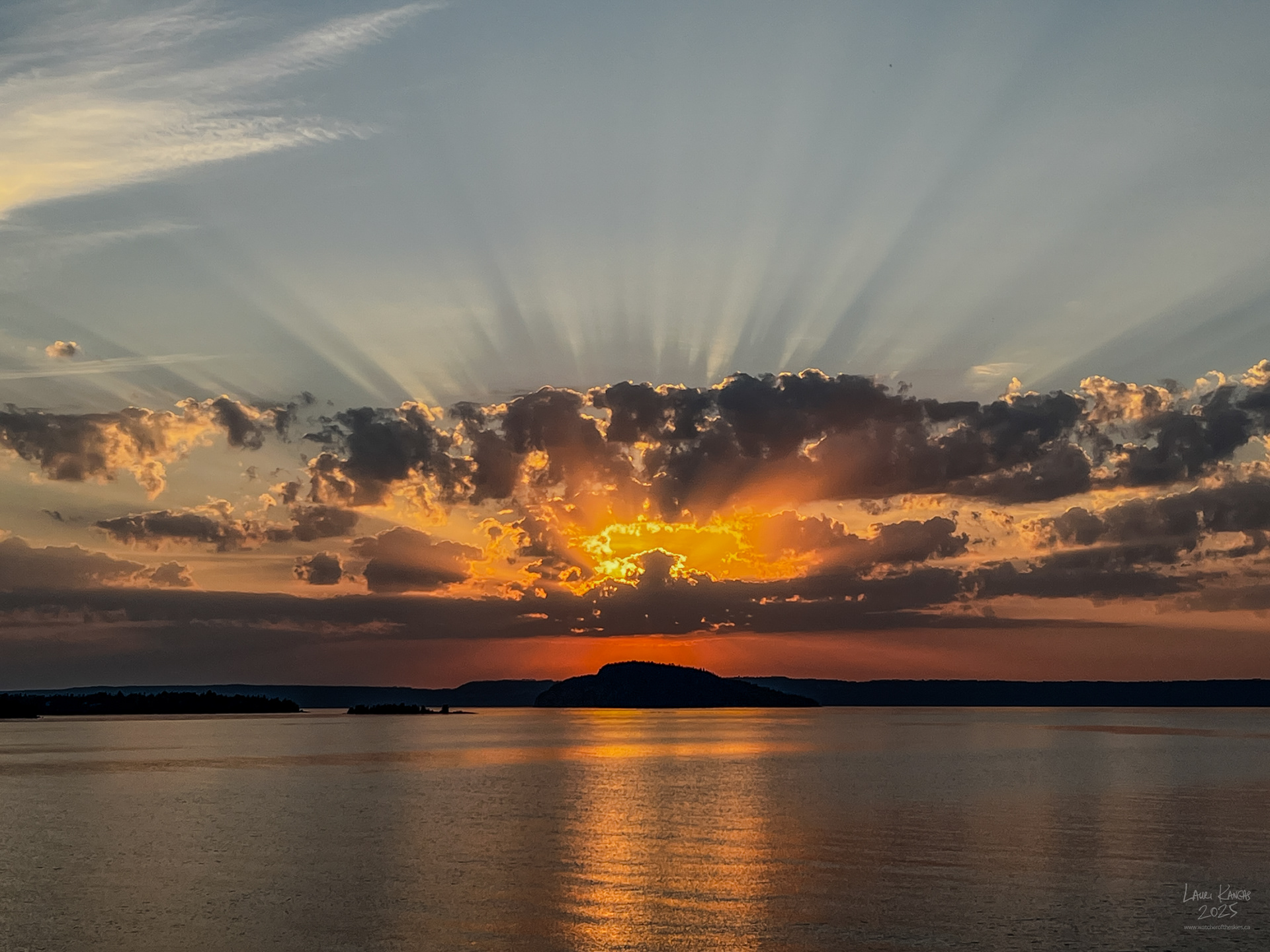 Sunrise crepuscular rays over Caribou Island, Amethyst Bay, Lake Superior - Oct 2, 2025