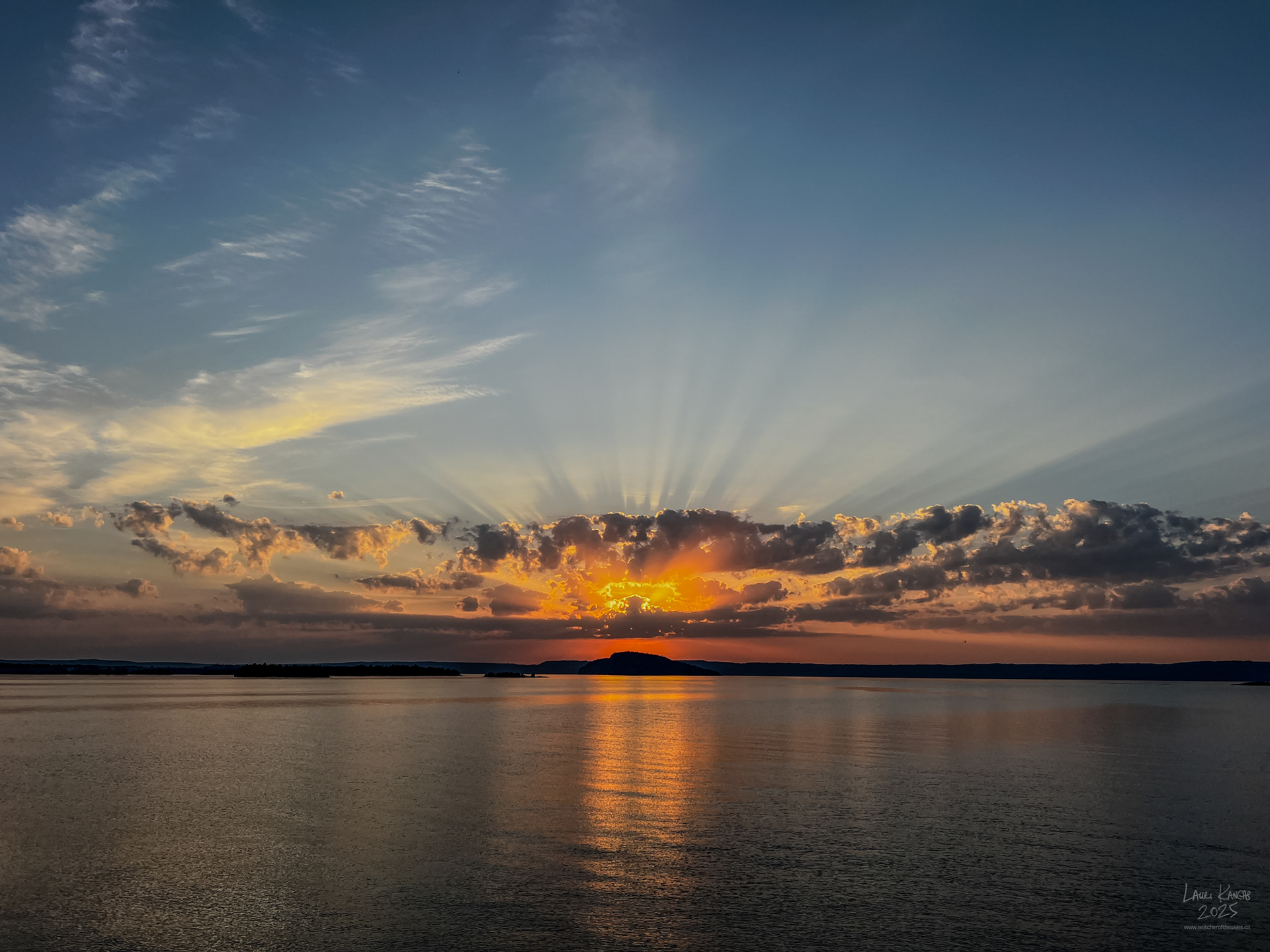 Sunrise crepuscular rays over Caribou Island, Amethyst Bay, Lake Superior - Oct 2, 2025