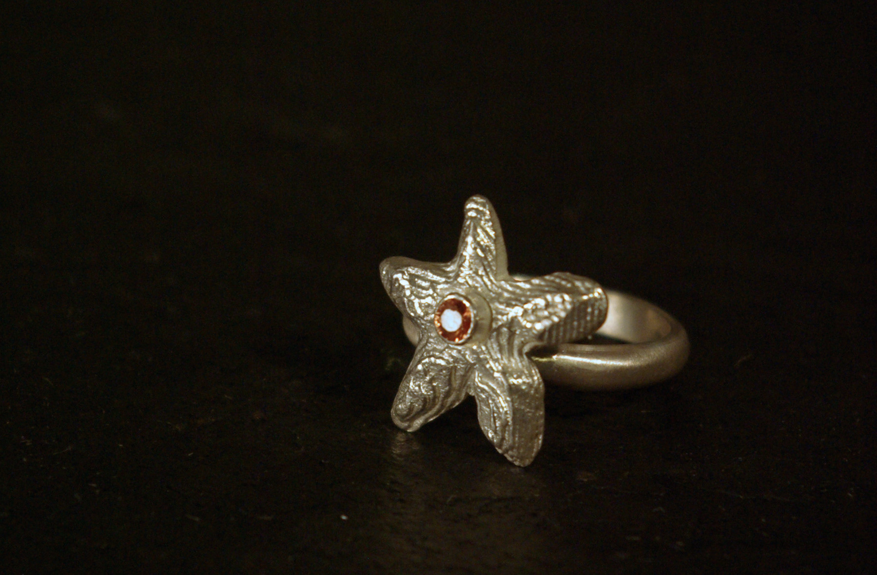 starfish ring, cuttlebone cast sterling silver, orange sapphire