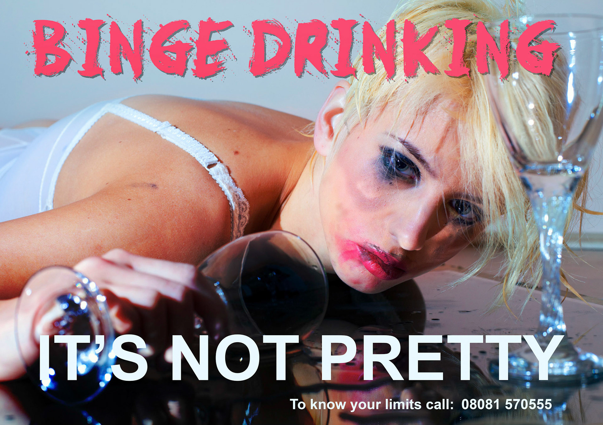 Drunk young woman with drinking glass