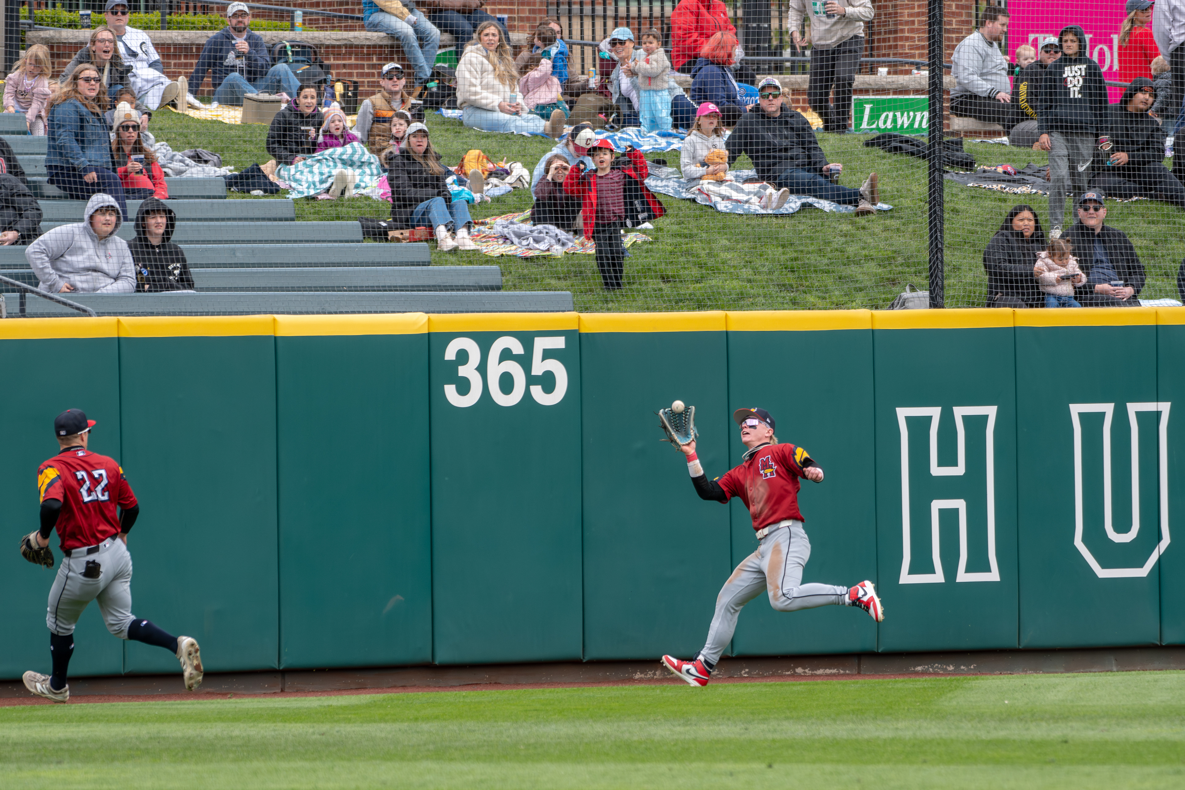 Outfielder Max Clark catches a fly ball near the Left Field wall at Huntington Park in Columbus, Ohio