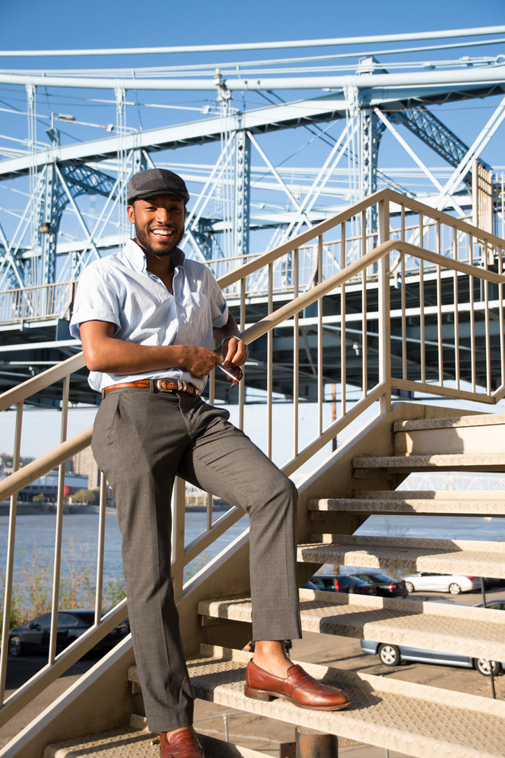 Singer Joseph Parrish poses while on the Roebling Bridge in Cincinnati