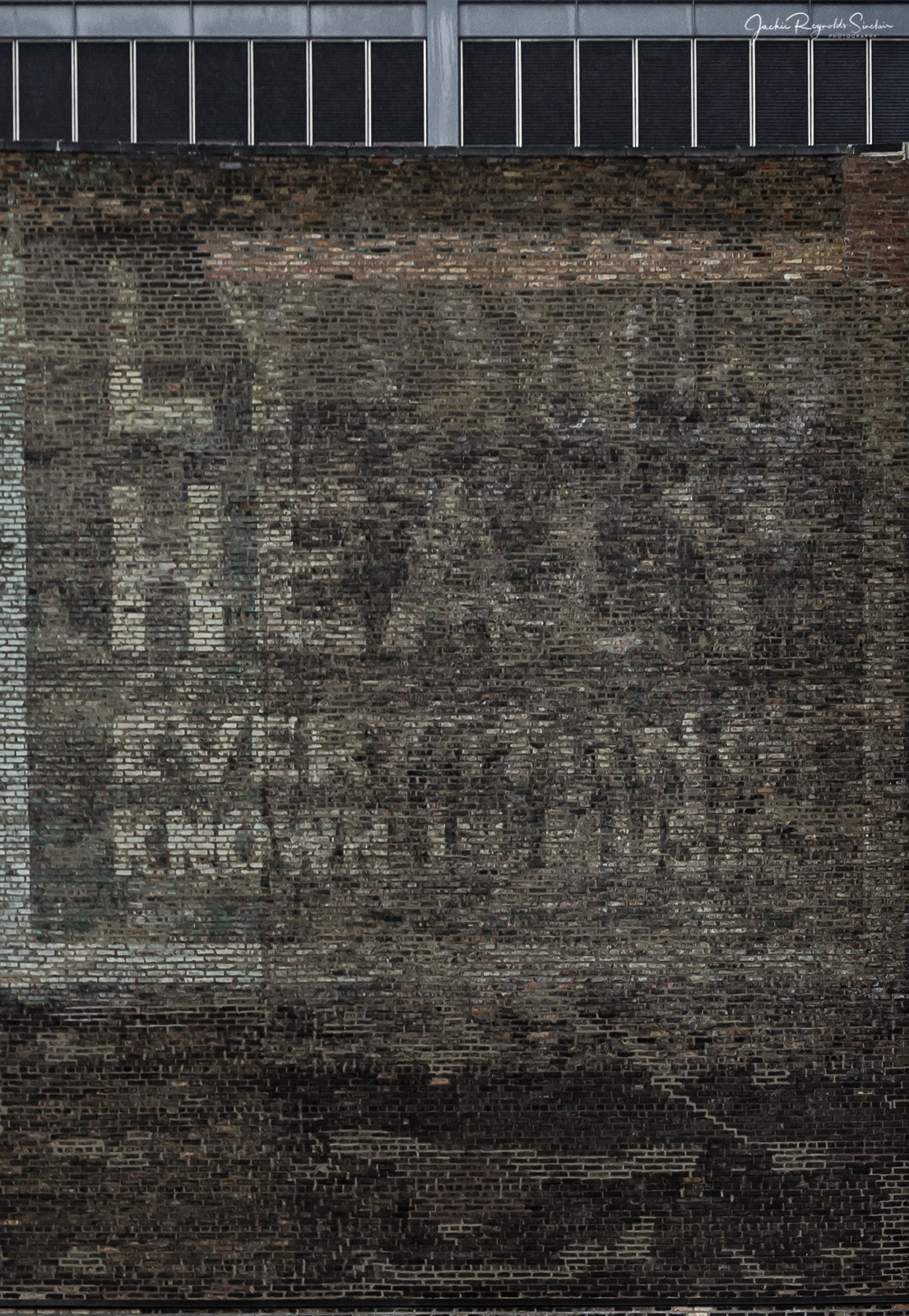 Ghost sign for Chicago Harp makers Lyon & Healy from a building on Wabash St.