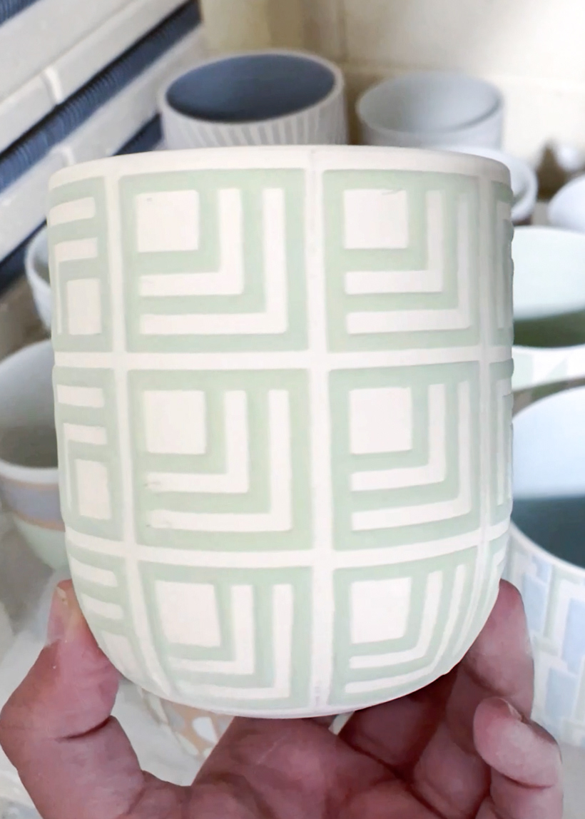 Porcelain cup after glazing before the final glaze firing