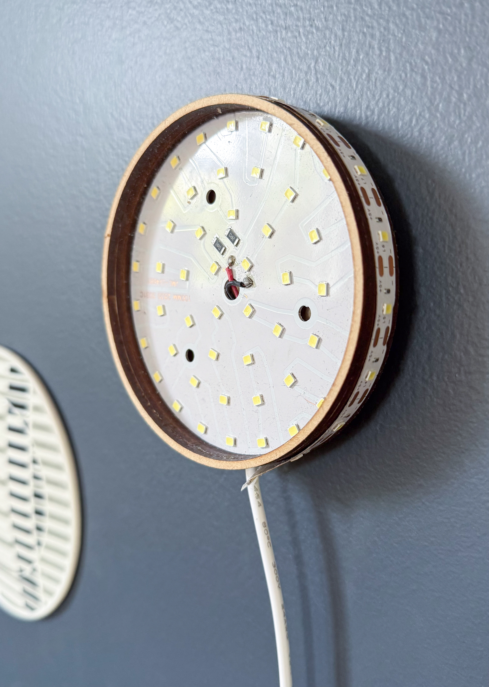 Lighting panel test - LED panel and strip attached to MDF, hung with a french cleat