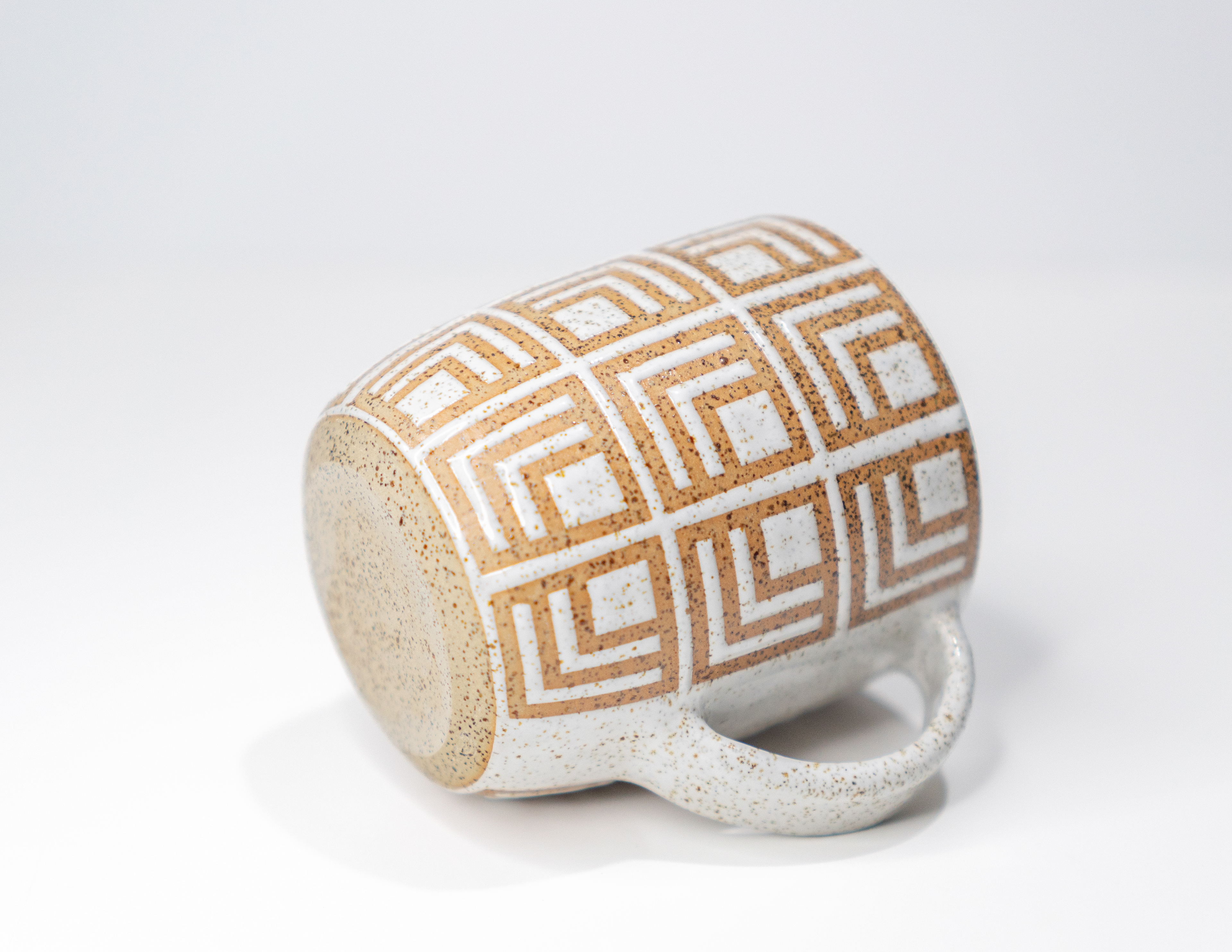 2024. Stoneware mixed with volcanic New Zealand beach sand, glazed using vinyl resist pattern designed digitally