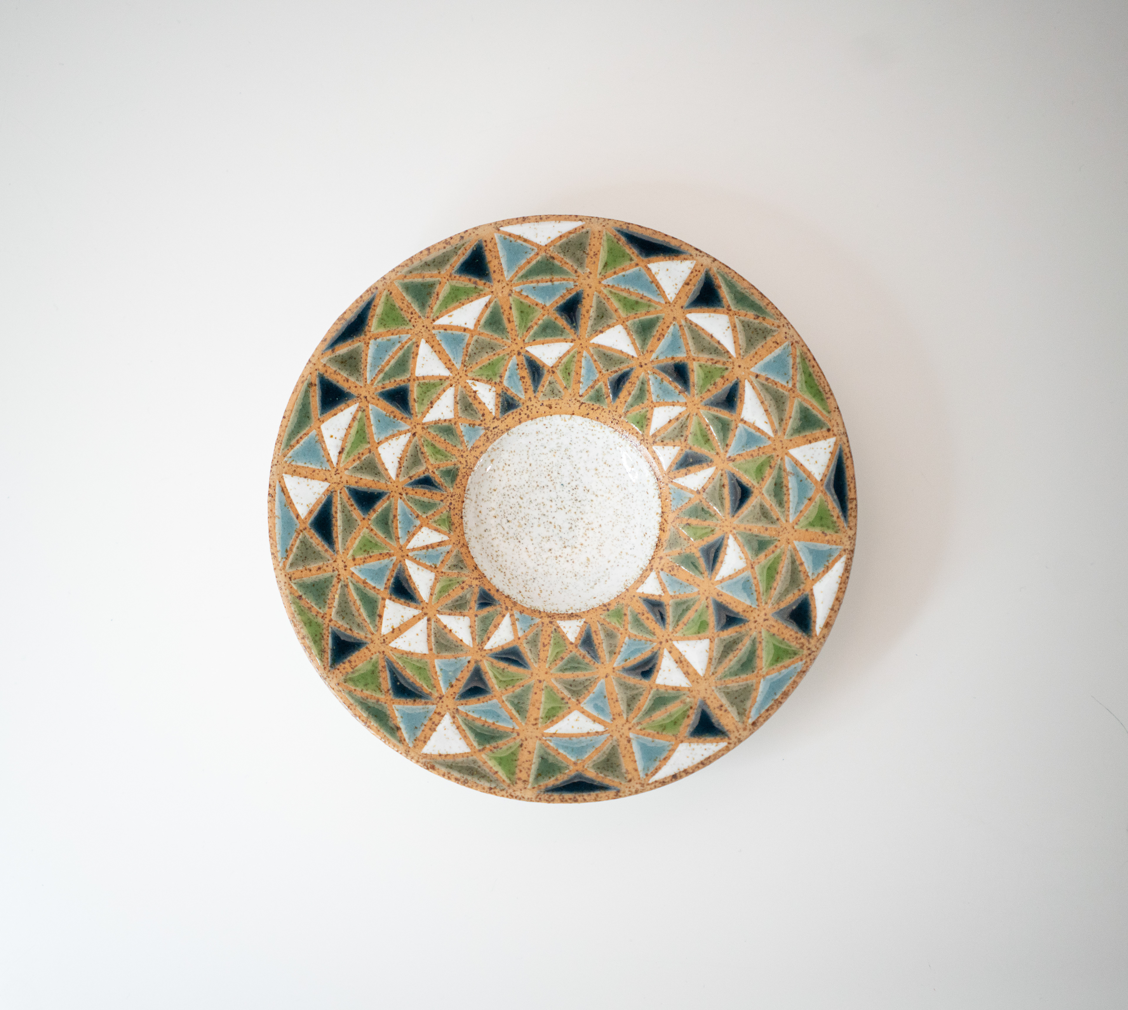 2024. Stoneware mixed with volcanic New Zealand beach sand, glazed using vinyl resist pattern designed digitally