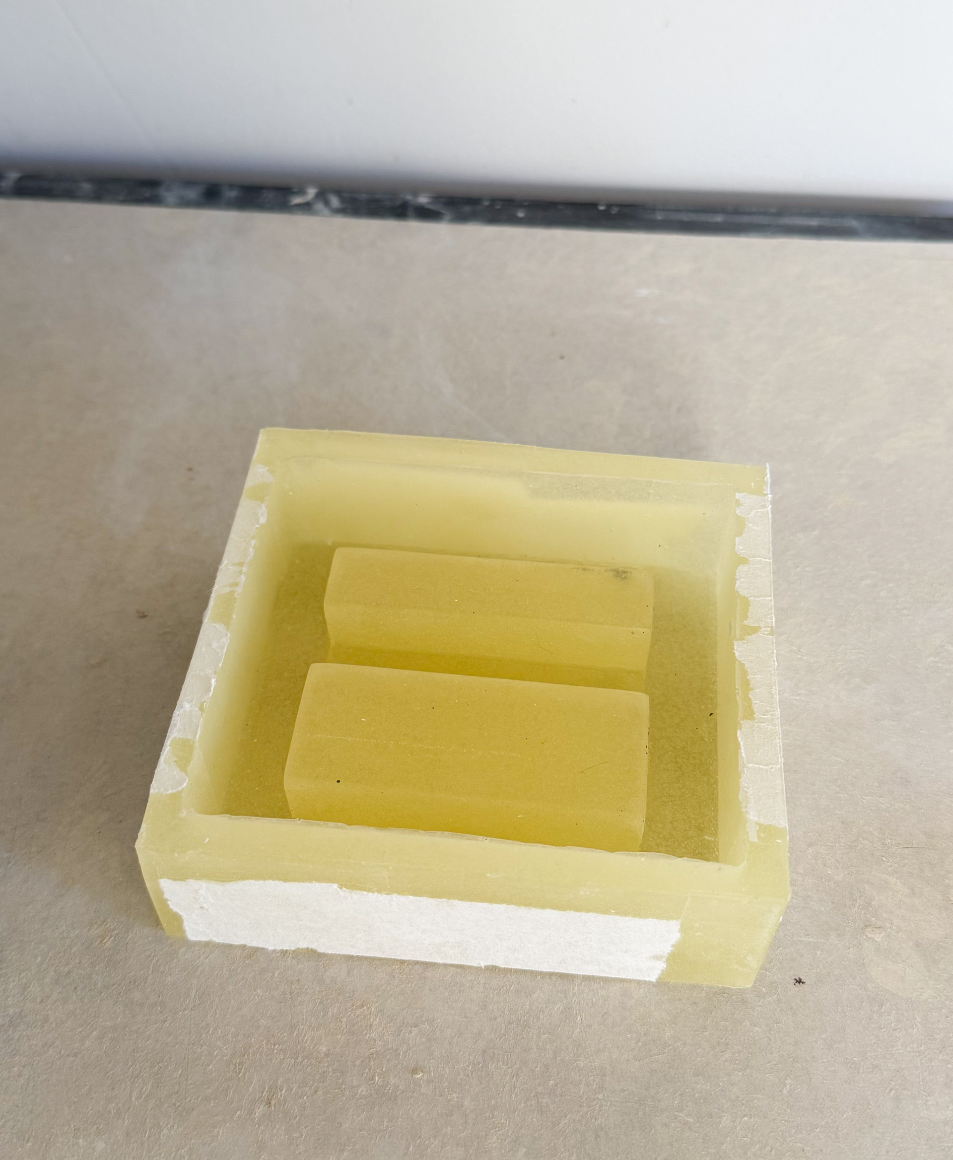 Test polyurethane mould for a phone stand made from a silicone mould made from a hand built wooden mould.