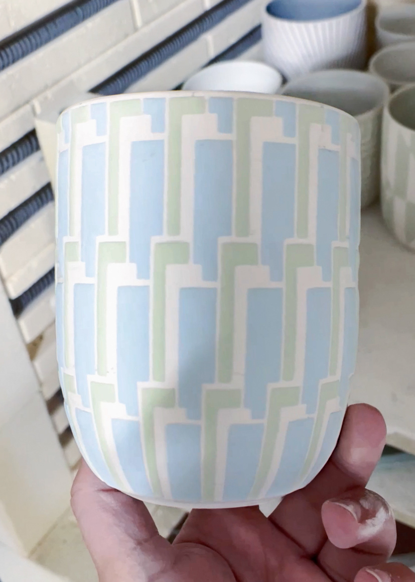 Porcelain cup after glazing before the final glaze firing