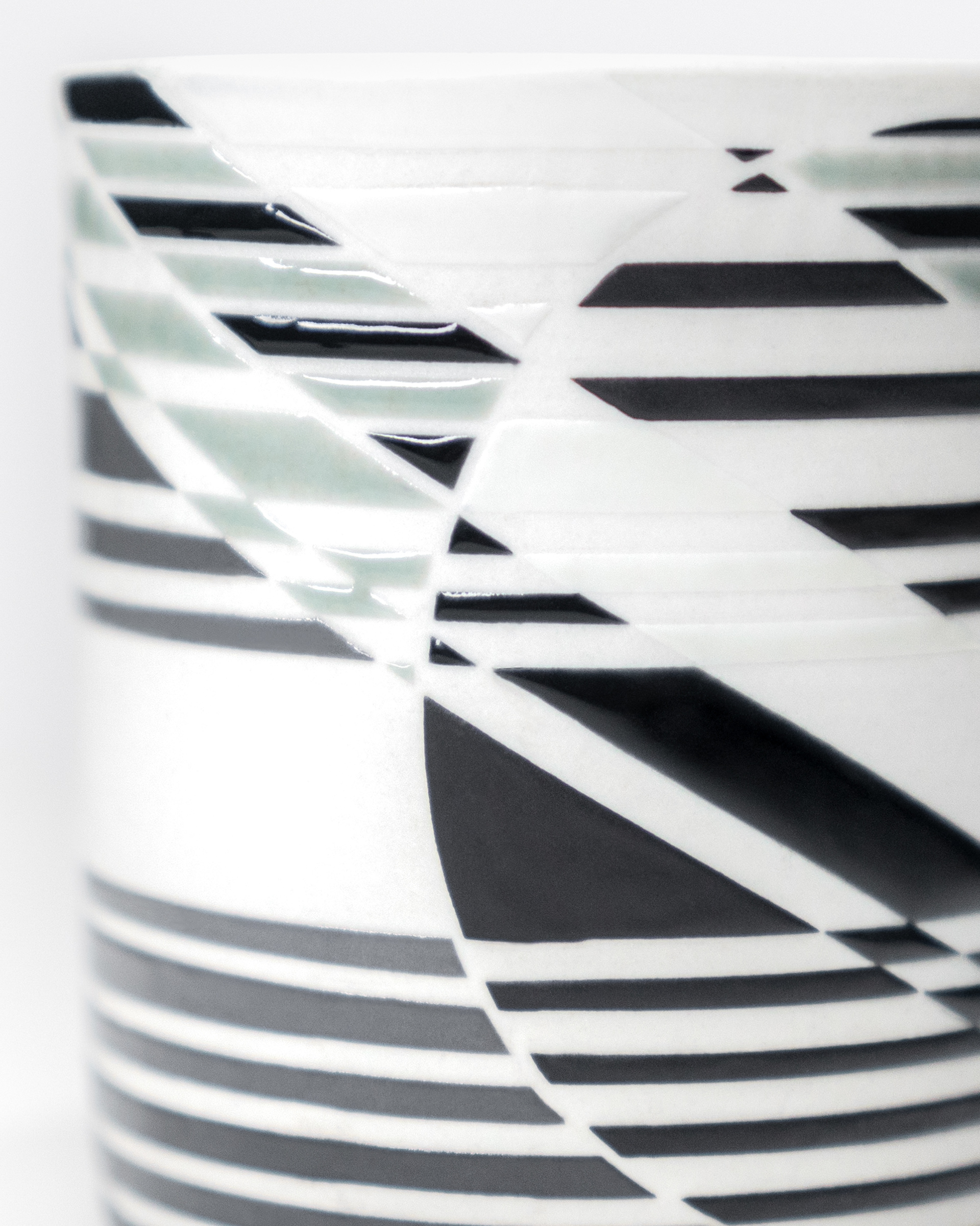 2024. Wheel thrown porcelain with geometric patterns designed digitally and glazed using vinyl resist
