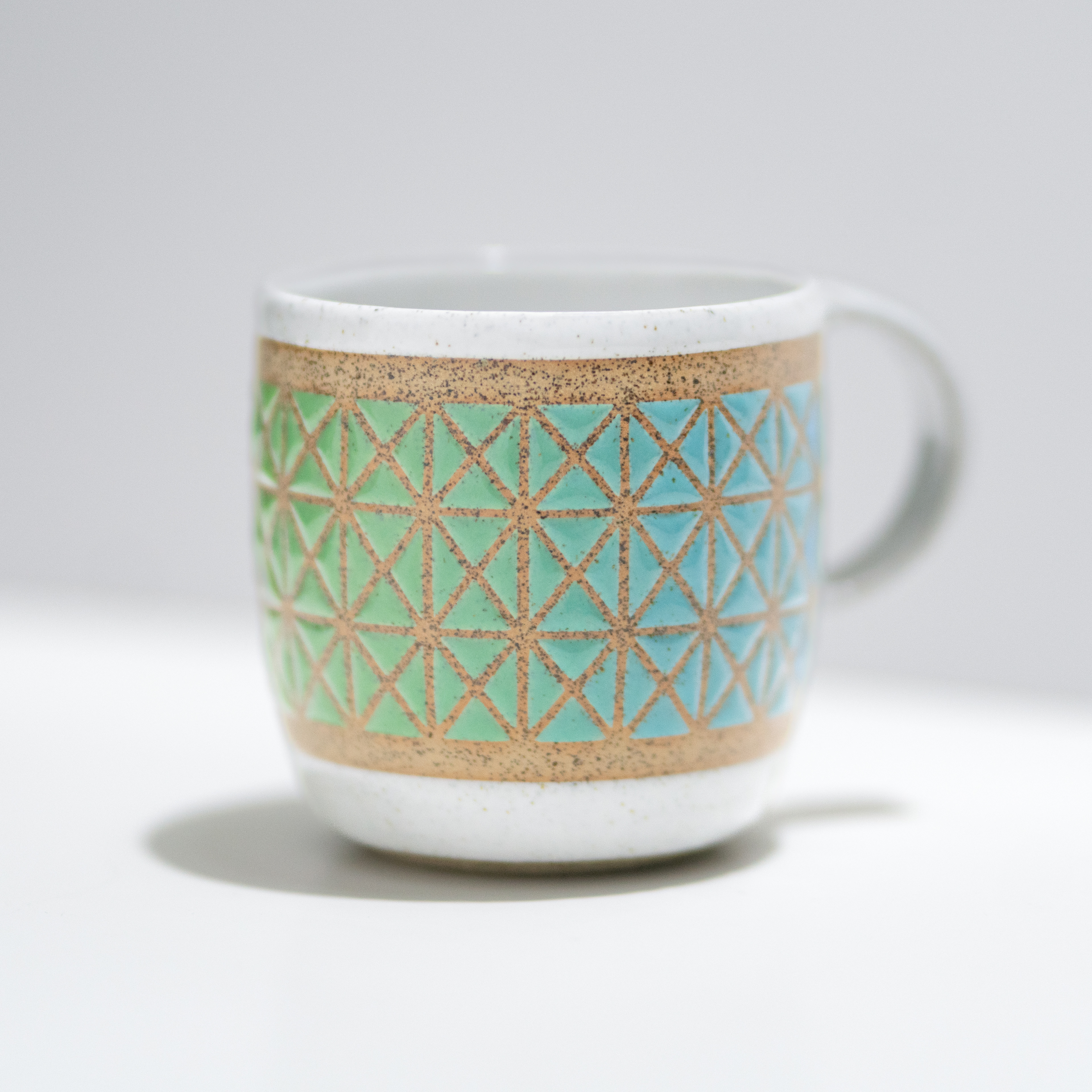 2024. Summer Show #10 - Oxford Gallery, Oxford. Ocean inspired gradient glazed on a mug using vinyl stencils.
