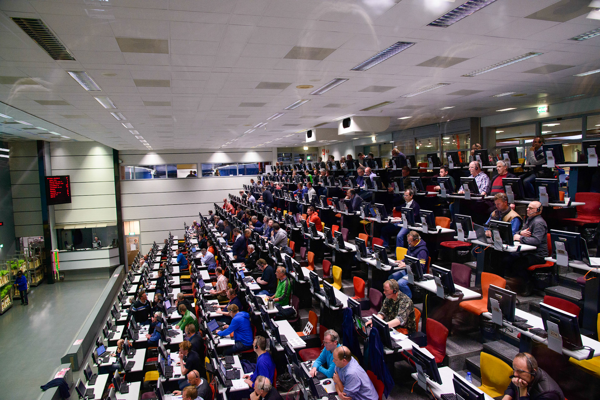 Aalsmeer Flower Auction is a flower auction that takes place in Aalsmeer, Netherlands. It is the largest flower auction in the world. The Aalsmeer Flower Auction building is the fourth largest building by footprint in the world, covering 518,000 square metres. Flowers from all over the world — Europe, Israel, Ecuador, Colombia, Ethiopia, Kenya, and other countries — are traded every day in this gigantic building.