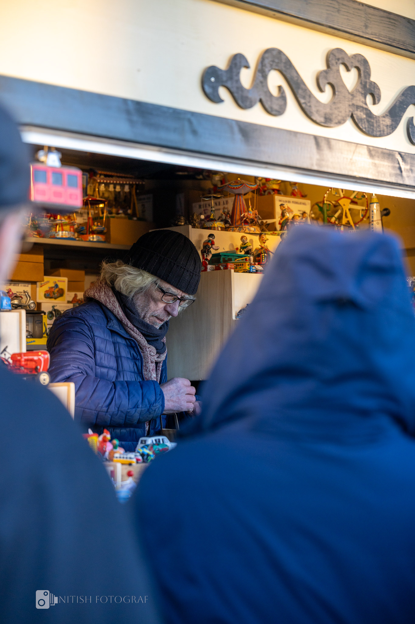 A cozy market stall where warmth and conversation thrive amidst the chill