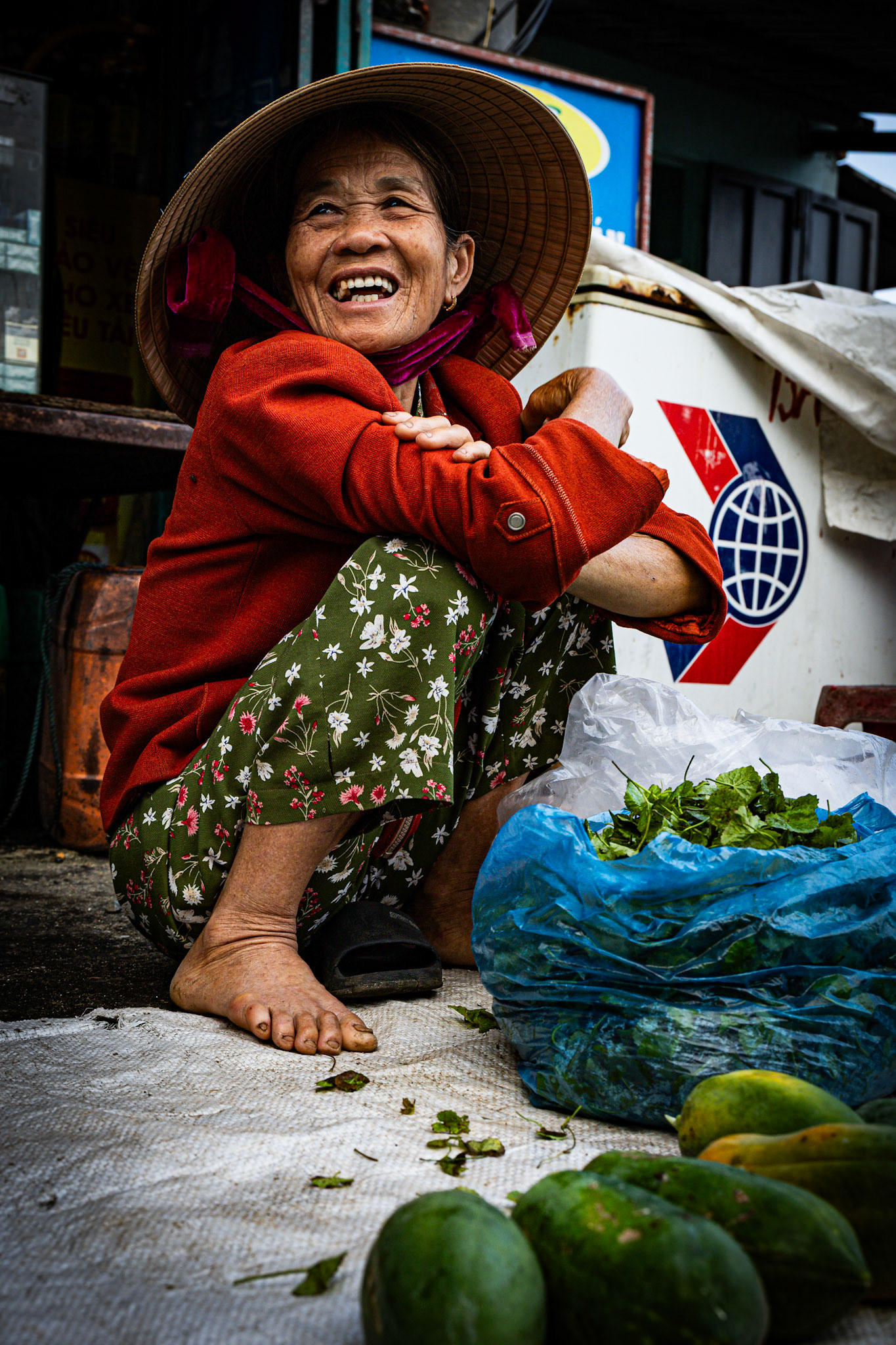 A smile as vibrant as the market itself—life’s simplest joys captured