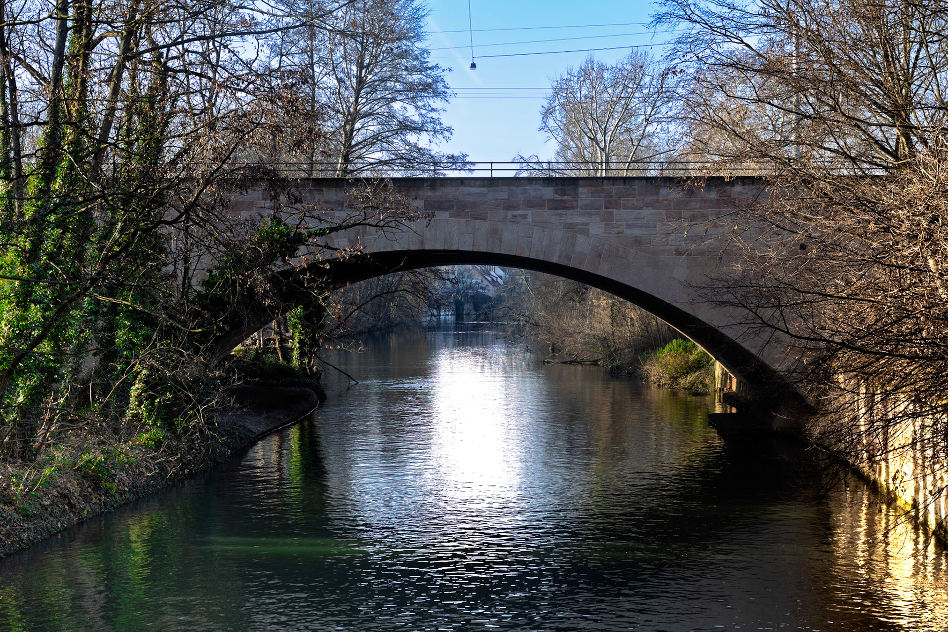 A timeless bridge reflected in the stillness of the water
