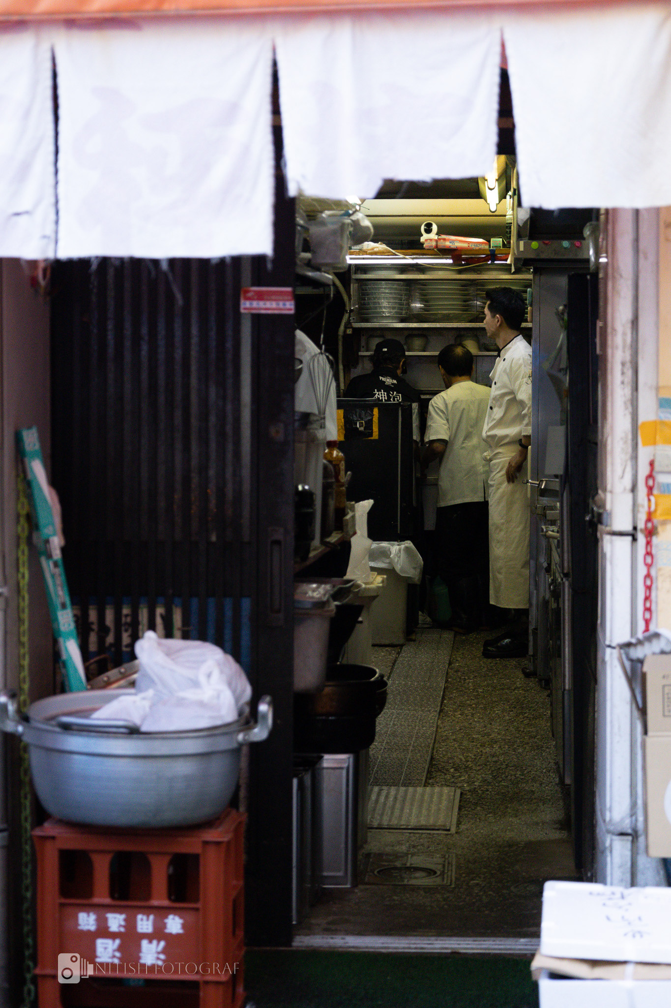 Behind the kitchen curtain lies the artistry of flavors—a chef's quiet dedication to tradition
