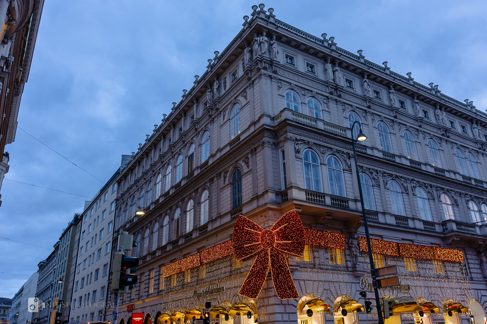 A sleek urban structure illuminated by the warm glow of evening lights