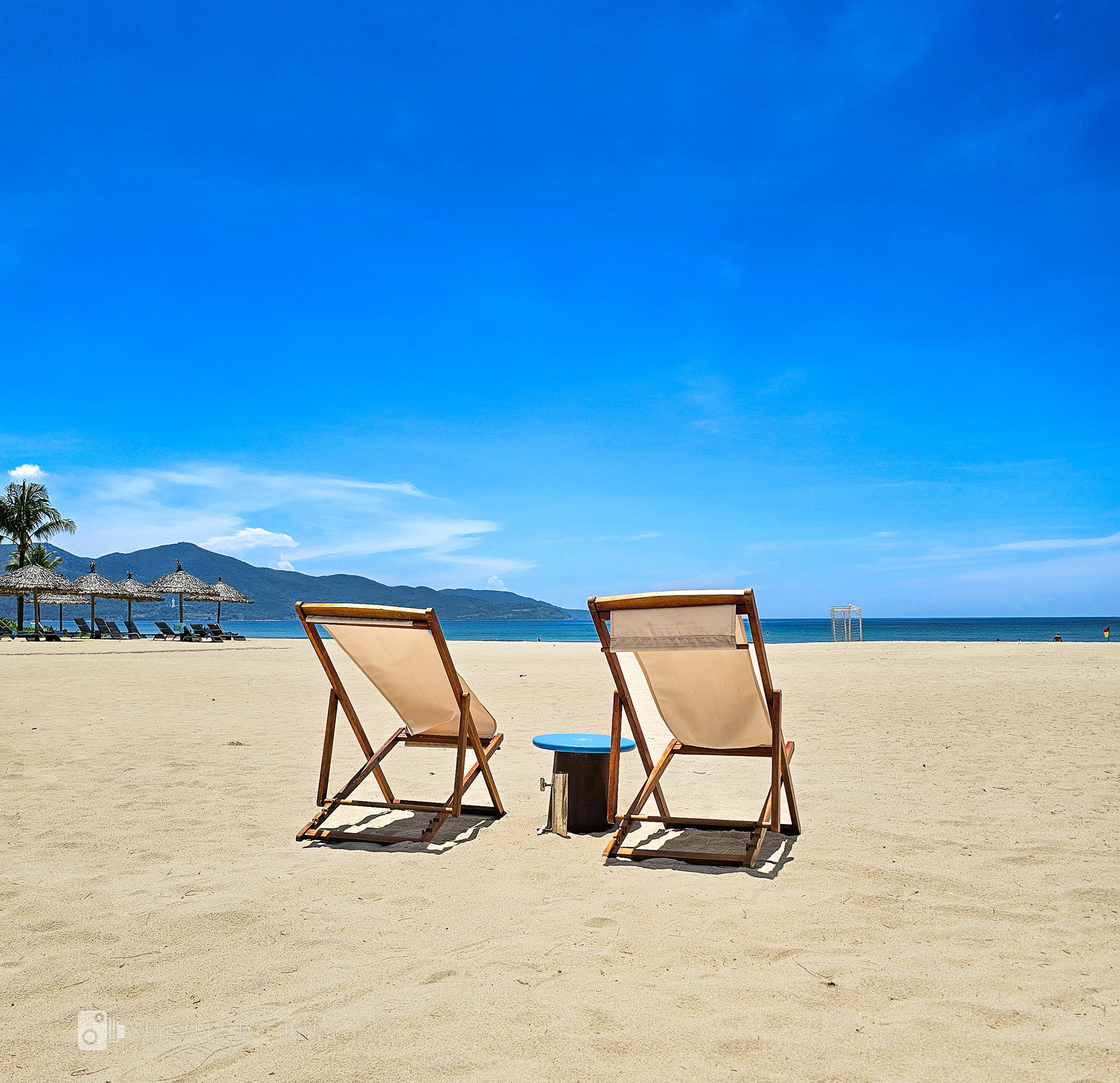 Beach chairs basking under a cloudless sky an invitation to unwind