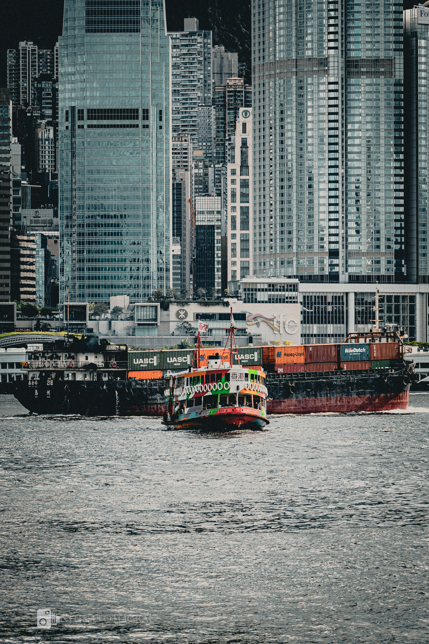 A bustling city street framed by towering skyscrapers and timeless charm