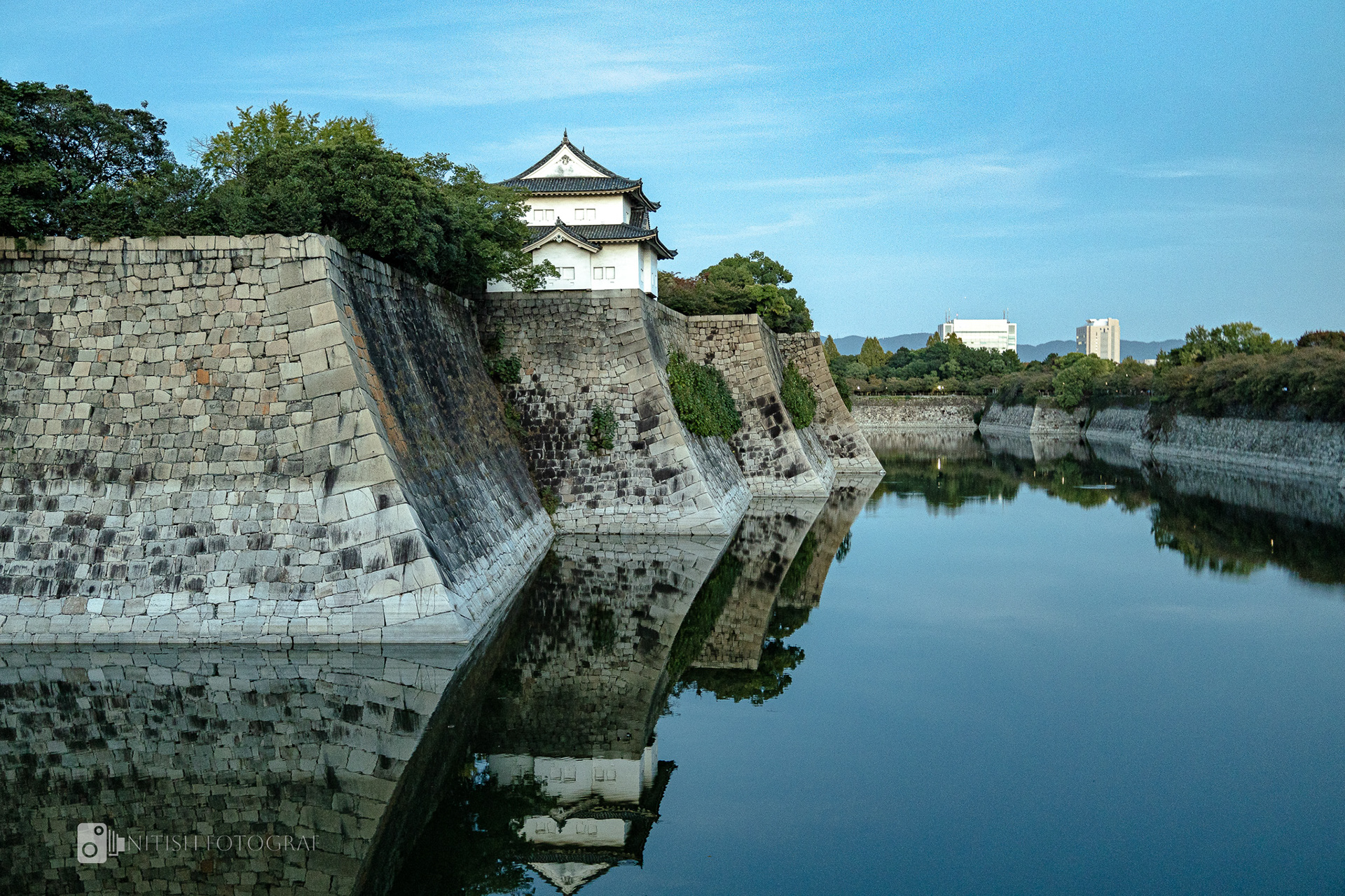 A historic moat mirroring the architecture of a bygone era