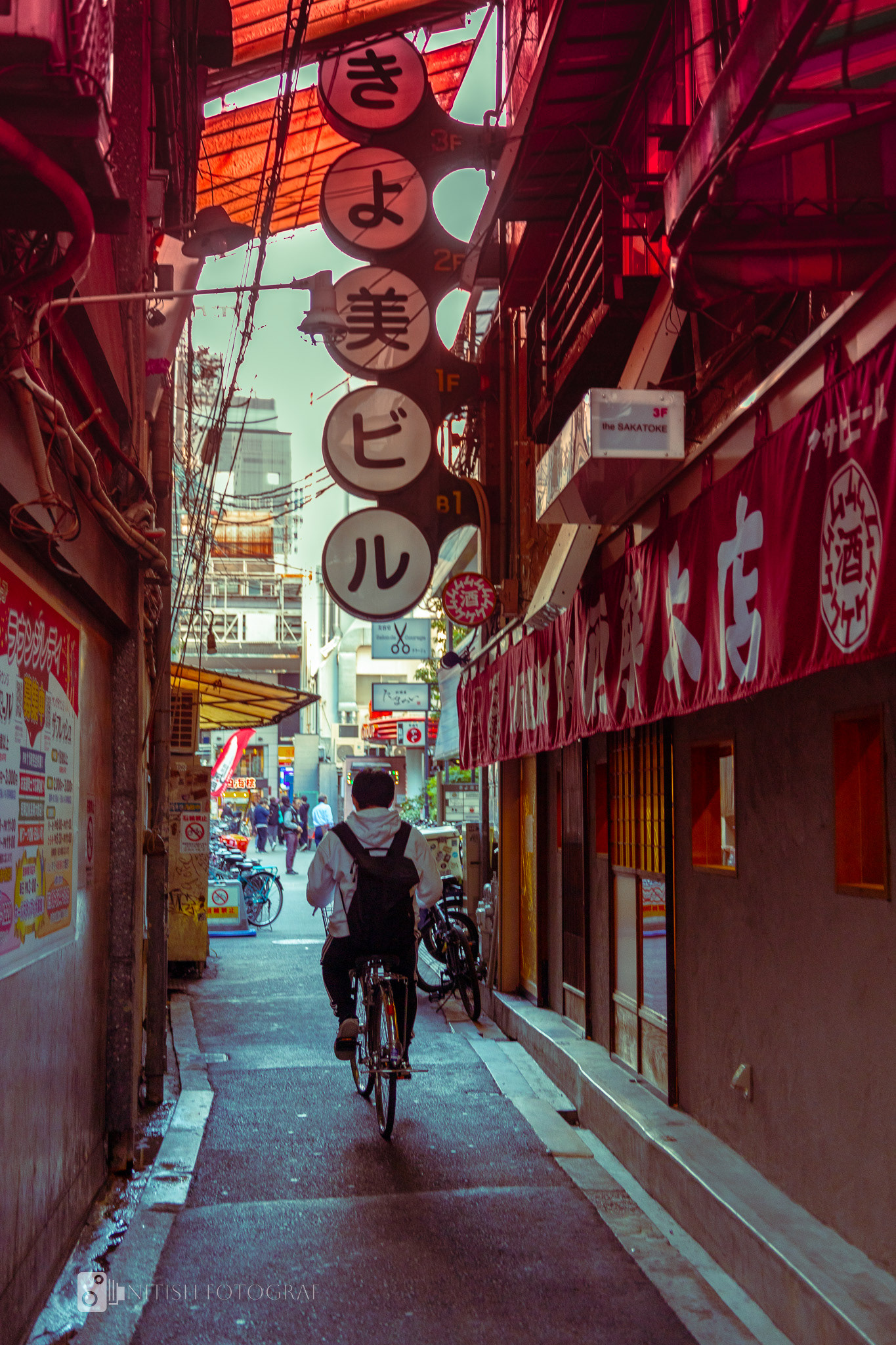 A narrow street illuminated by the glow of tradition and modernity