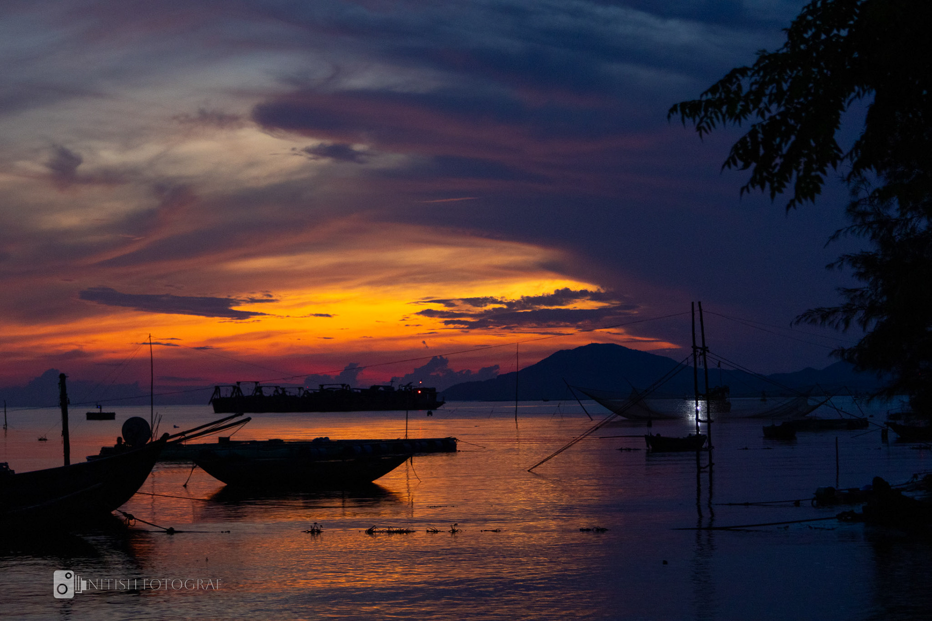 The sun rises over a still ocean capturing the essence of peace