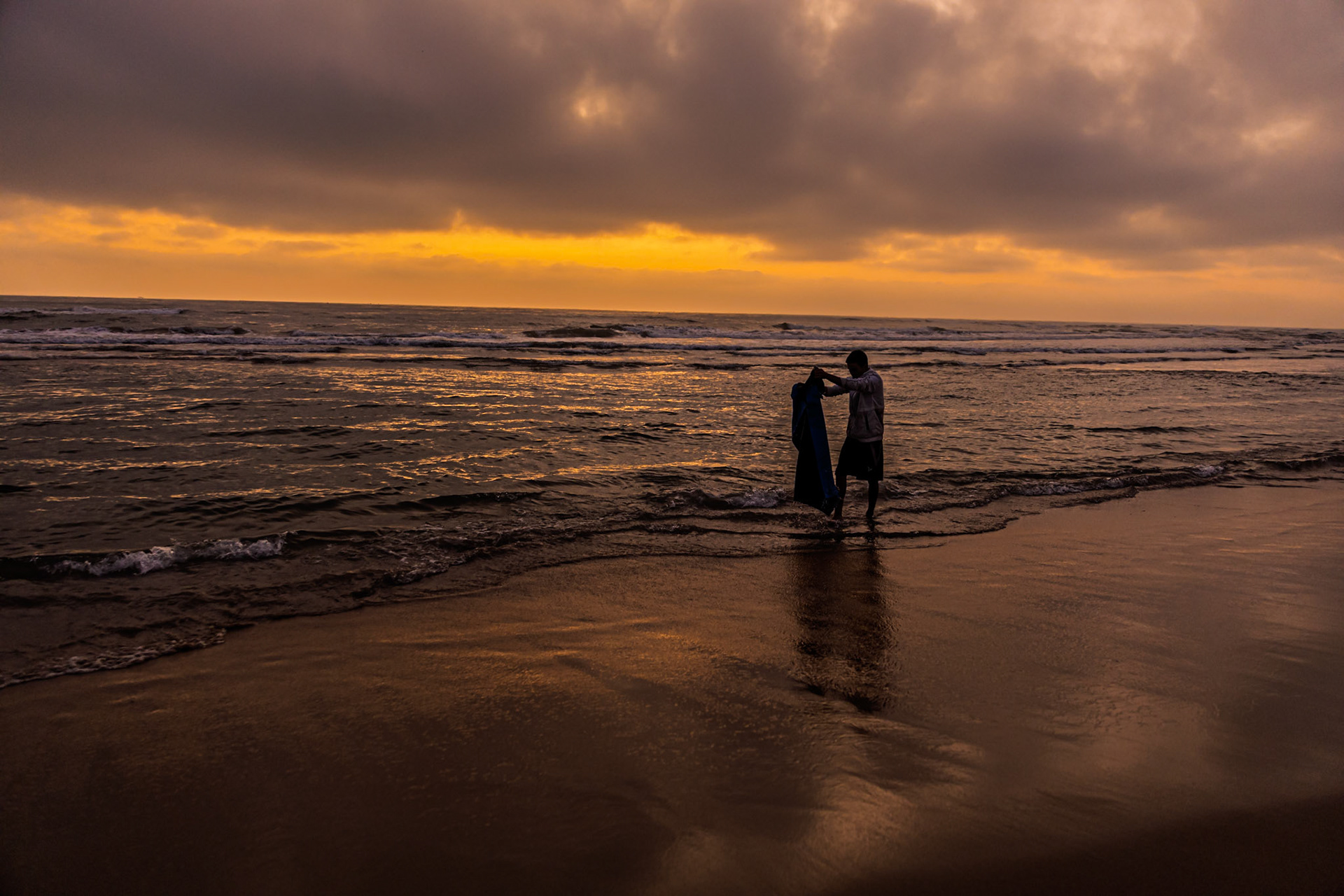 Strength and unity as the waves watch over the daily labor of life