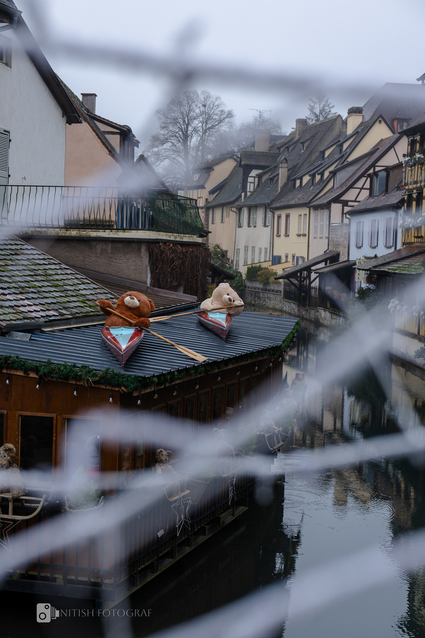 Snow-covered rooftops glowing softly under the light of a tranquil day