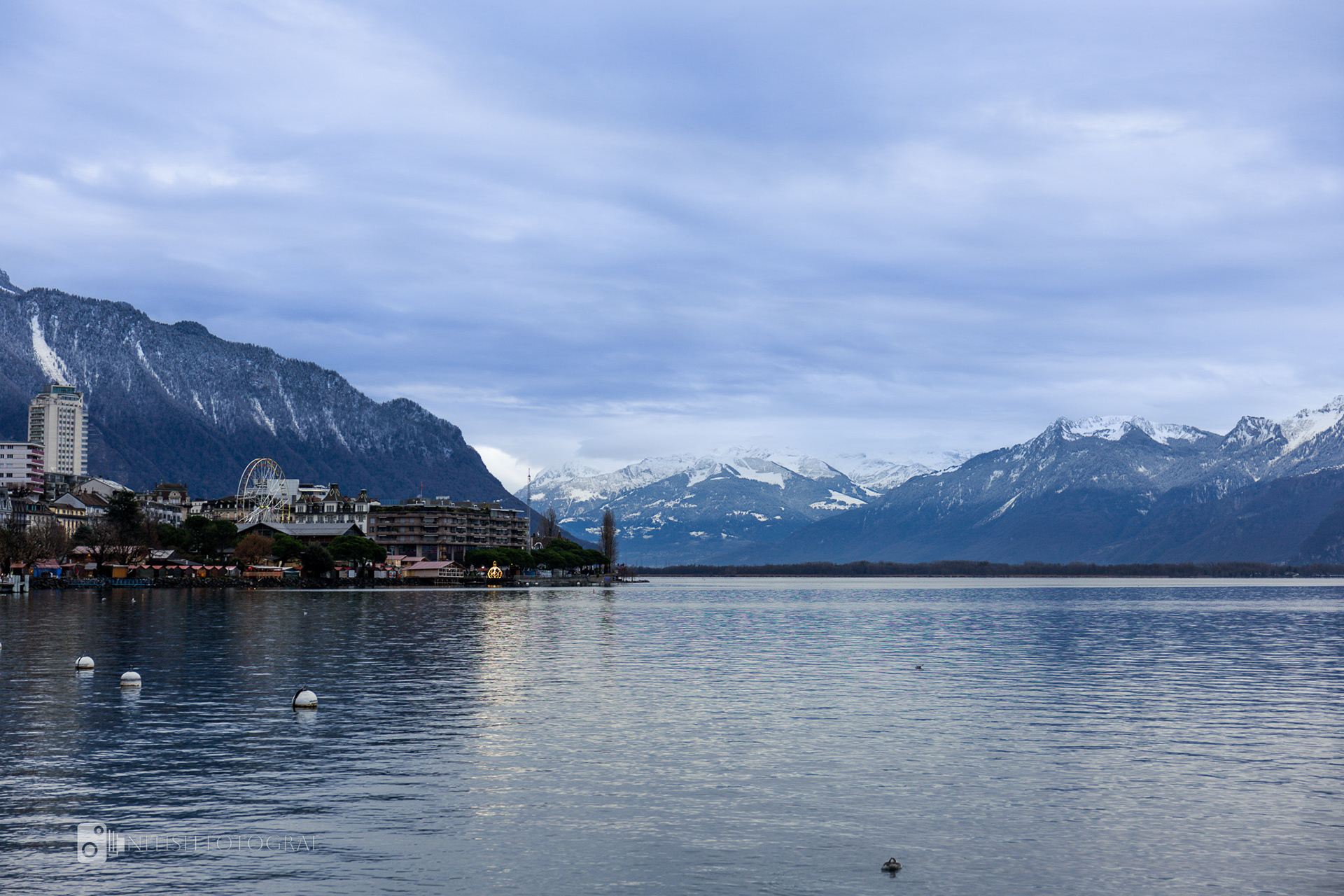 Crystal-clear waters mirroring the majesty of alpine peaks
