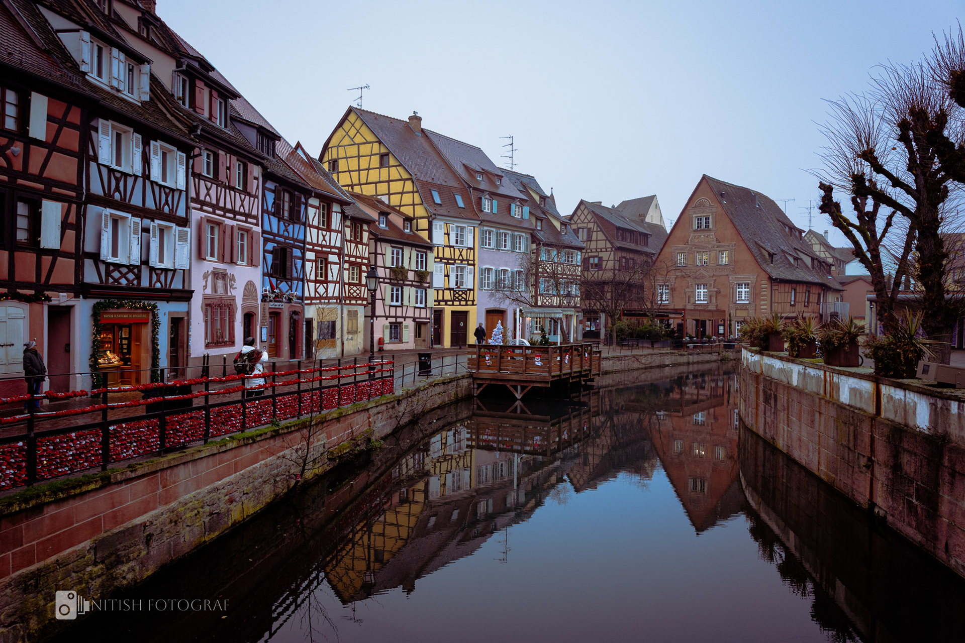 A quaint village mirrored in still waters evoking a sense of nostalgia
