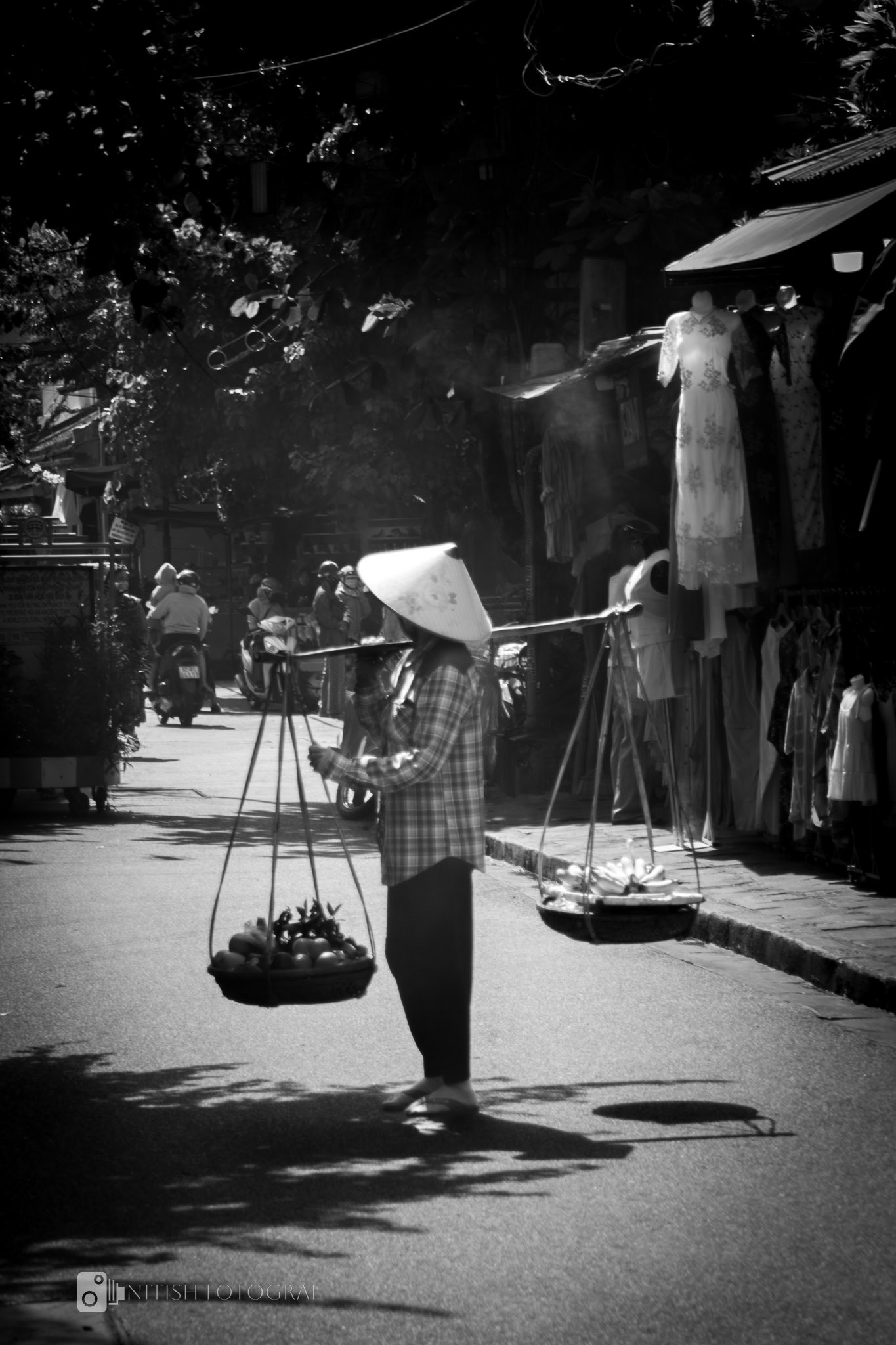 Balancing tradition – a quiet rhythm of daily life on sunlit streets