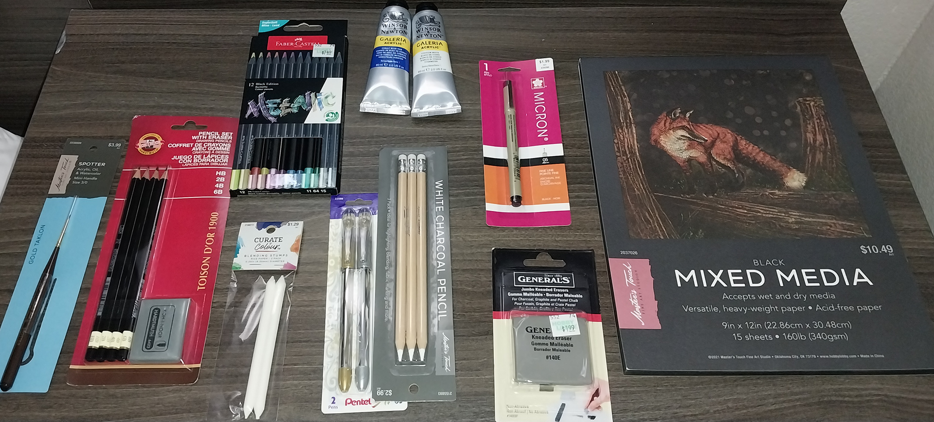 Acrylic paint, ink pens, pencils, smudge tools, metallic colored pencils, scratchboard, black and white mixed media paper, mini canvases, brushes, white charcoal pencils, and a nifty battery operated eraser!