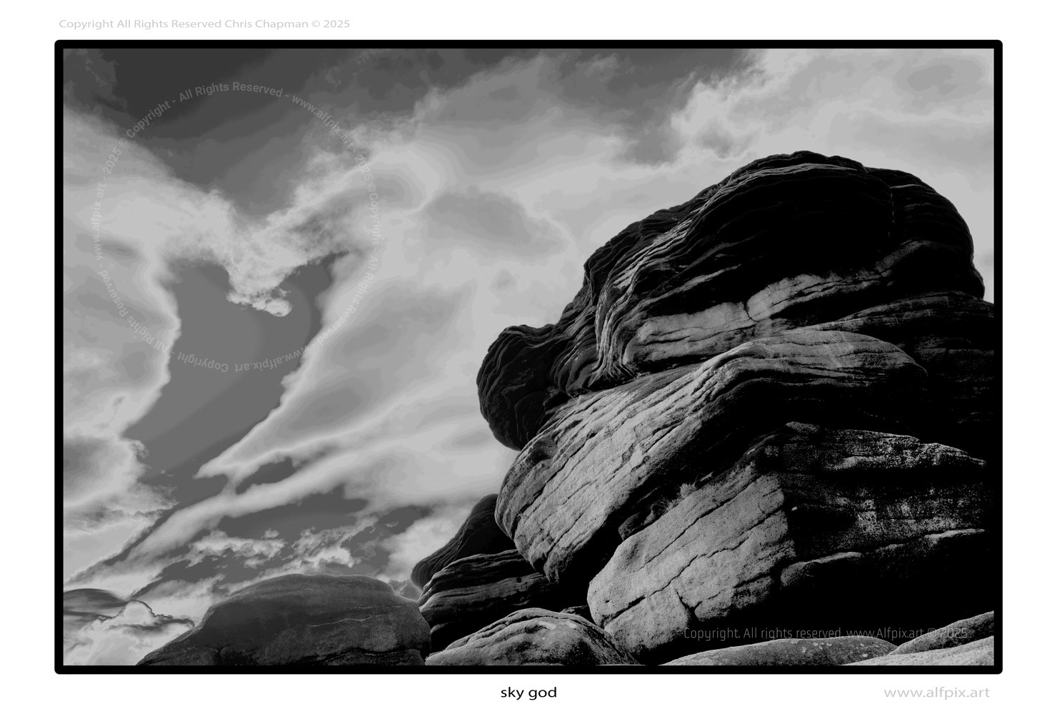 Black and White. Skygod. Dramatic alien sky. Rocks in profile. 
