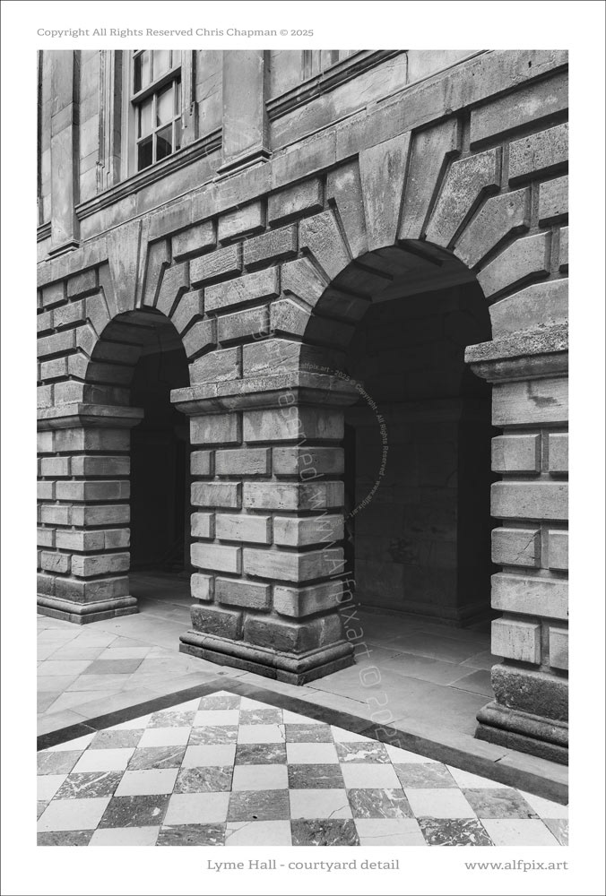 Detail of stonework of Lyme Hall Inner courtyard. Black and White. Chequered floor tiles.