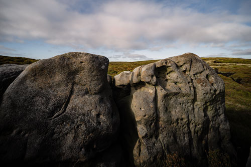 Scarred rocks on Bleaklow. Possible the result of a shooter firing his shotgun at the rocks? Who can say for sure? Colour image. alfpix.art chris chapman 