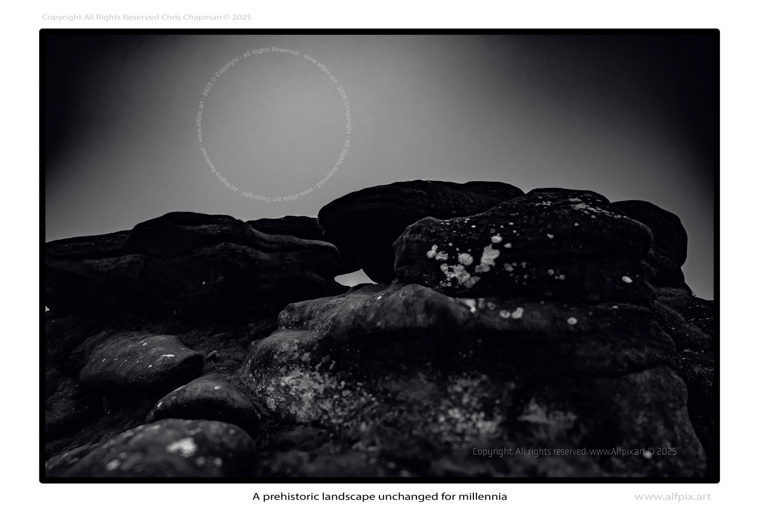 Monochrome image of a hilly rocky landscape, unchanged for millions of years. 