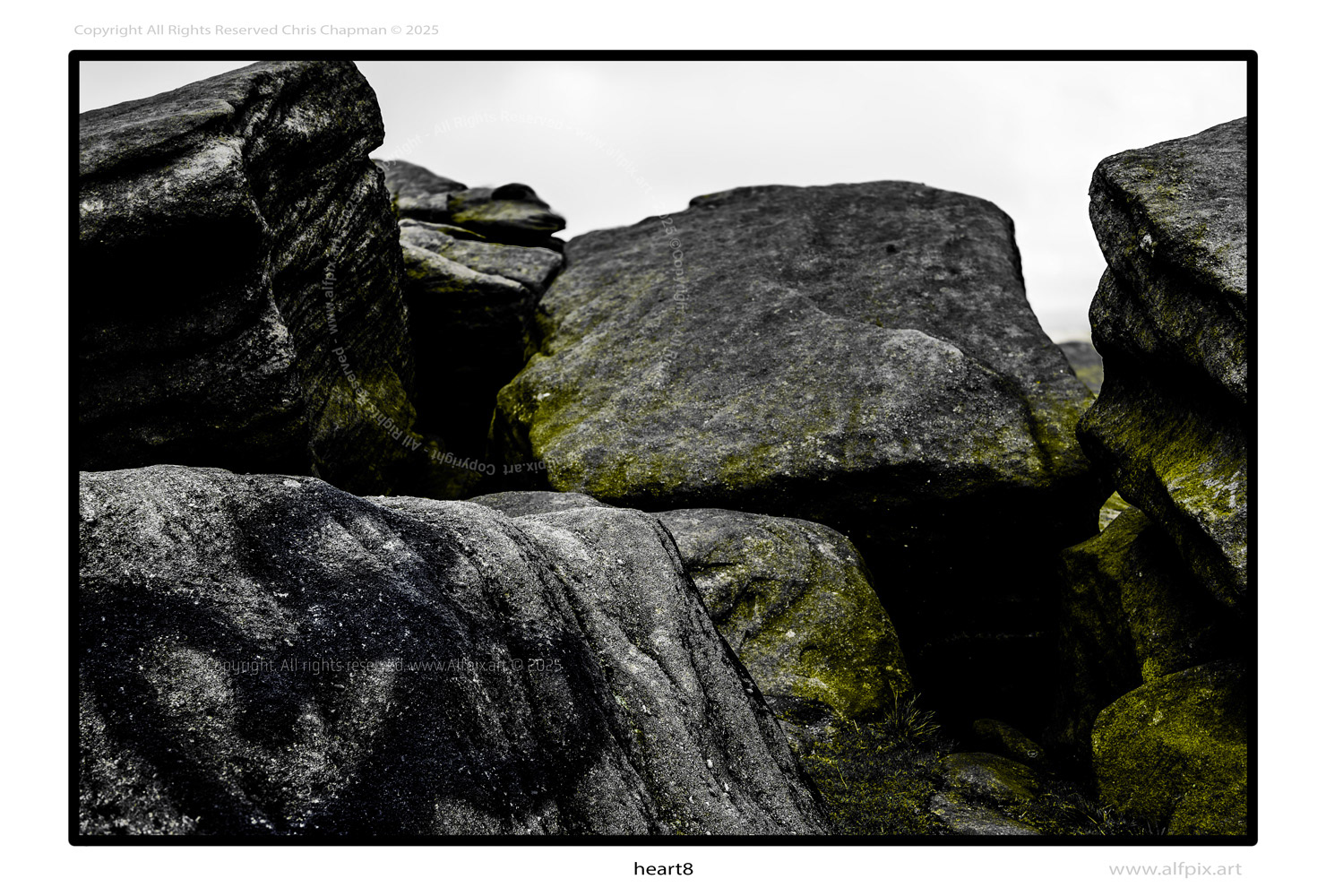 Rocks. Graffiti. Black and white image with yellow overlay. 